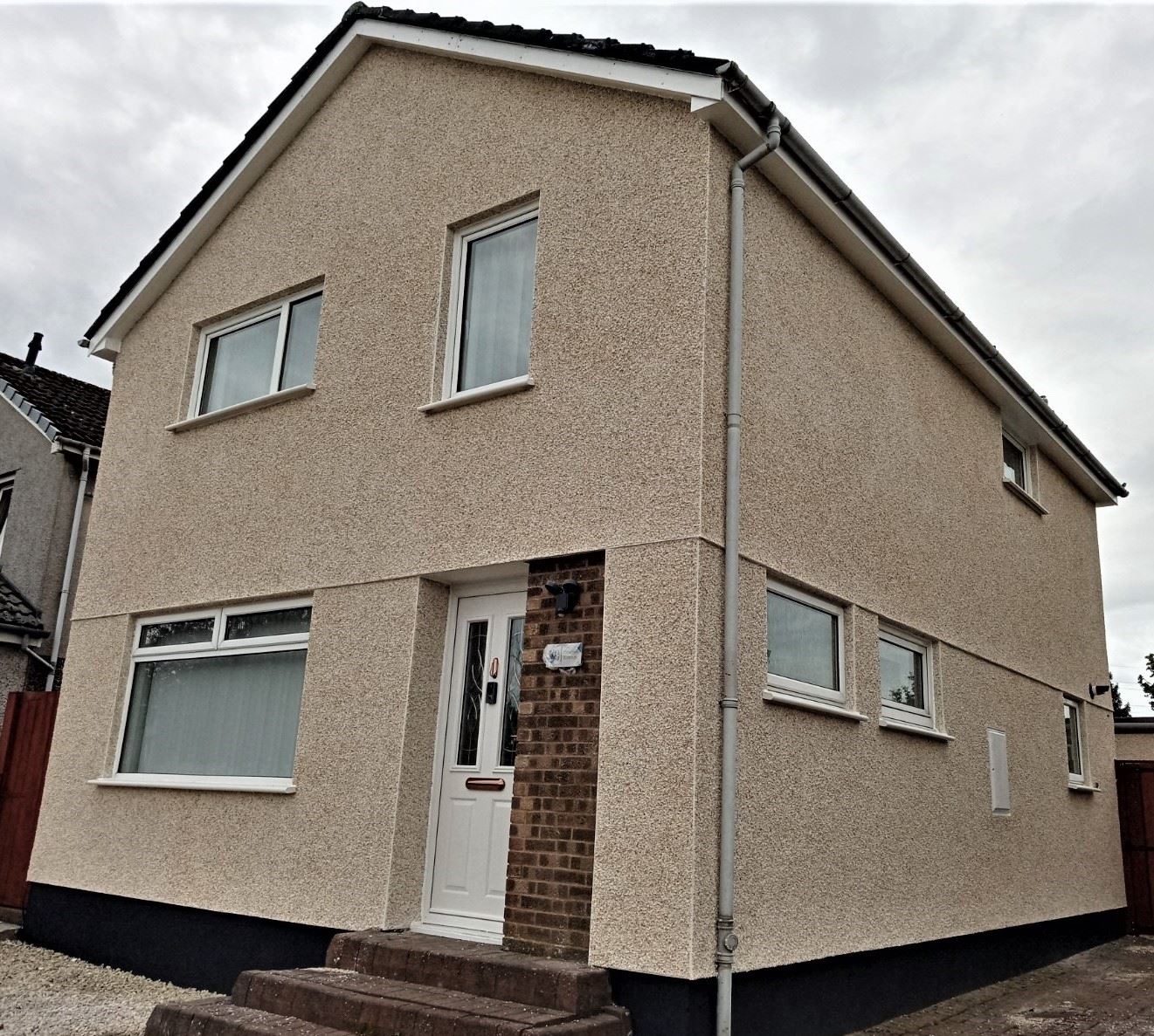 solid wall insulation Edinburgh on front façade with brown entrance door