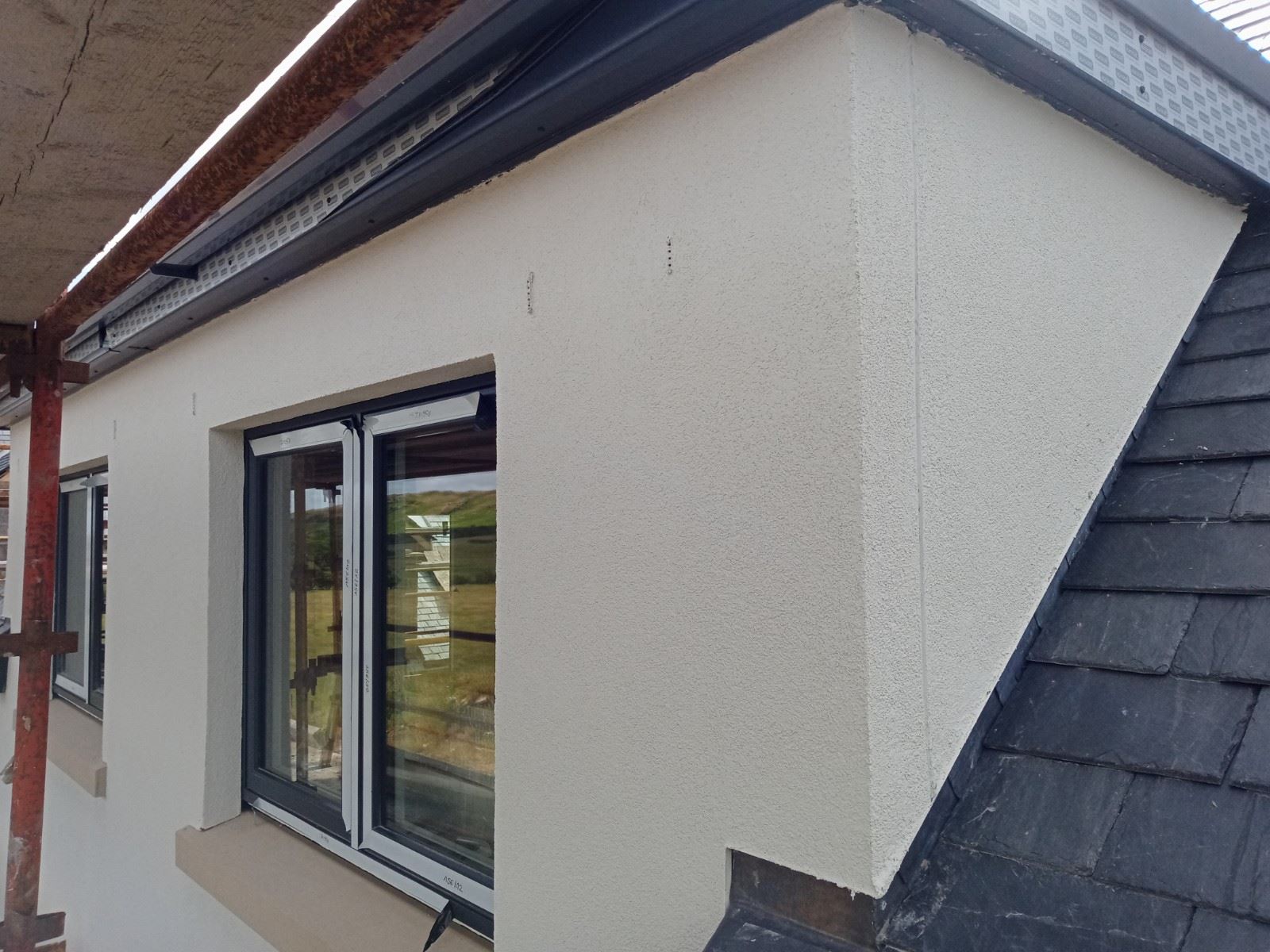 external wall insulation Edinburgh under installation on scaffolded wall