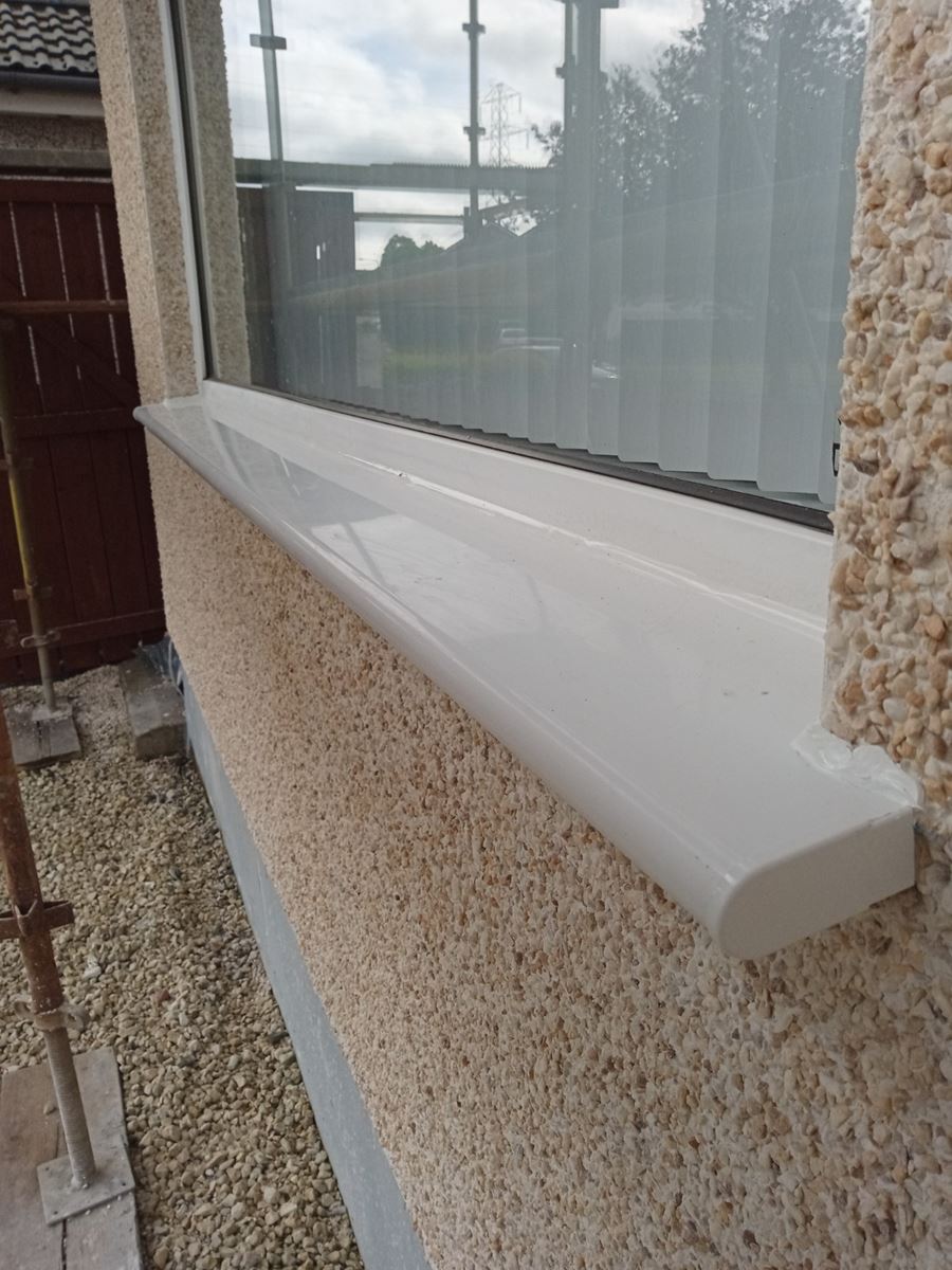 roughcasting Edinburgh on freshly finished white window sill detail