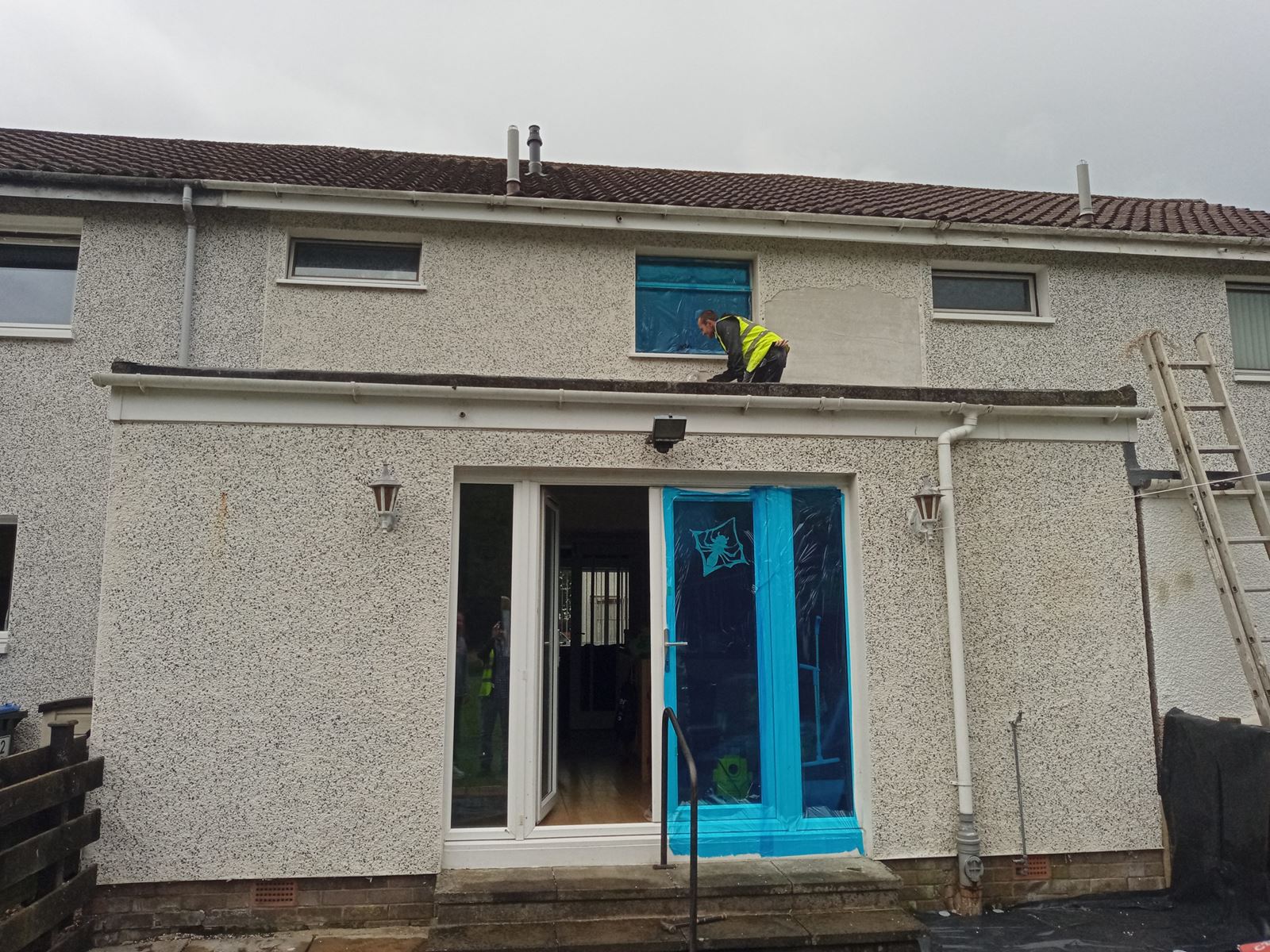 house rendering Edinburgh on back elevation with patio doors covered