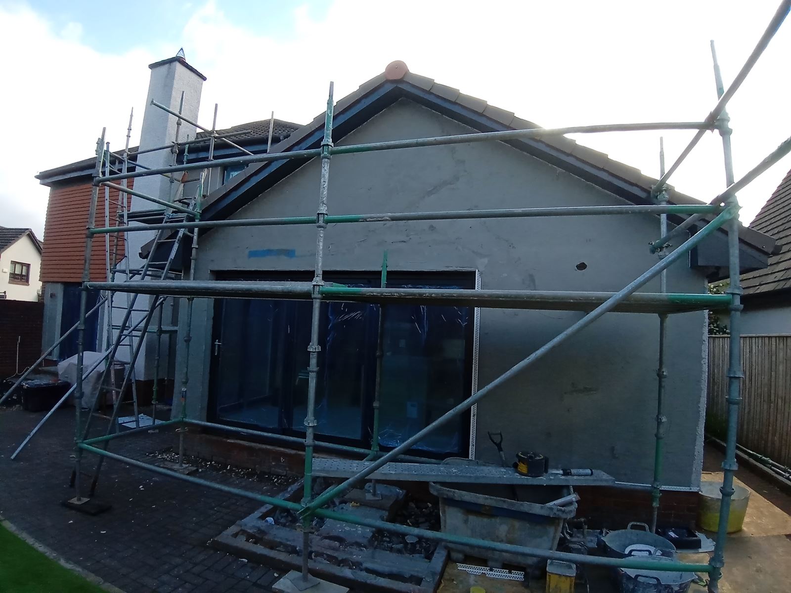 external wall insulation Edinburgh on house rear wall under scaffolding