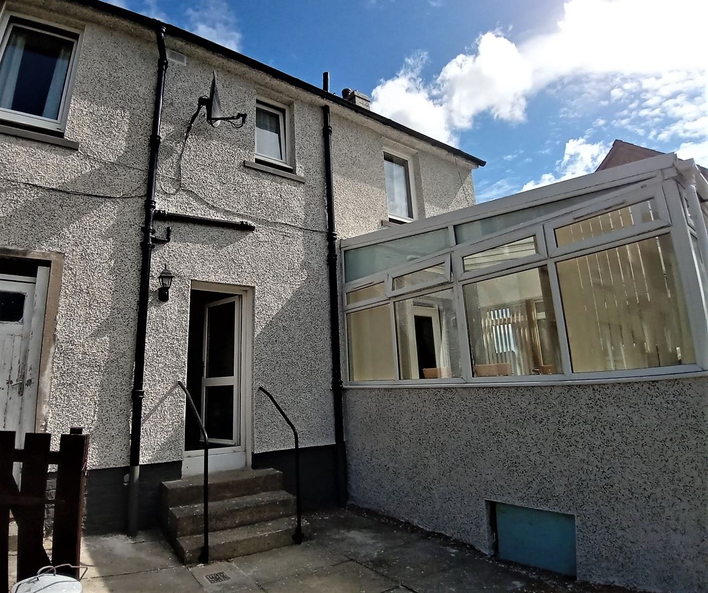 house rendering Edinburgh on two-storey semi-detached with white door
