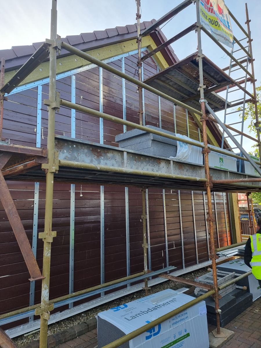 house rendering Edinburgh on property wall with new insulation fixings