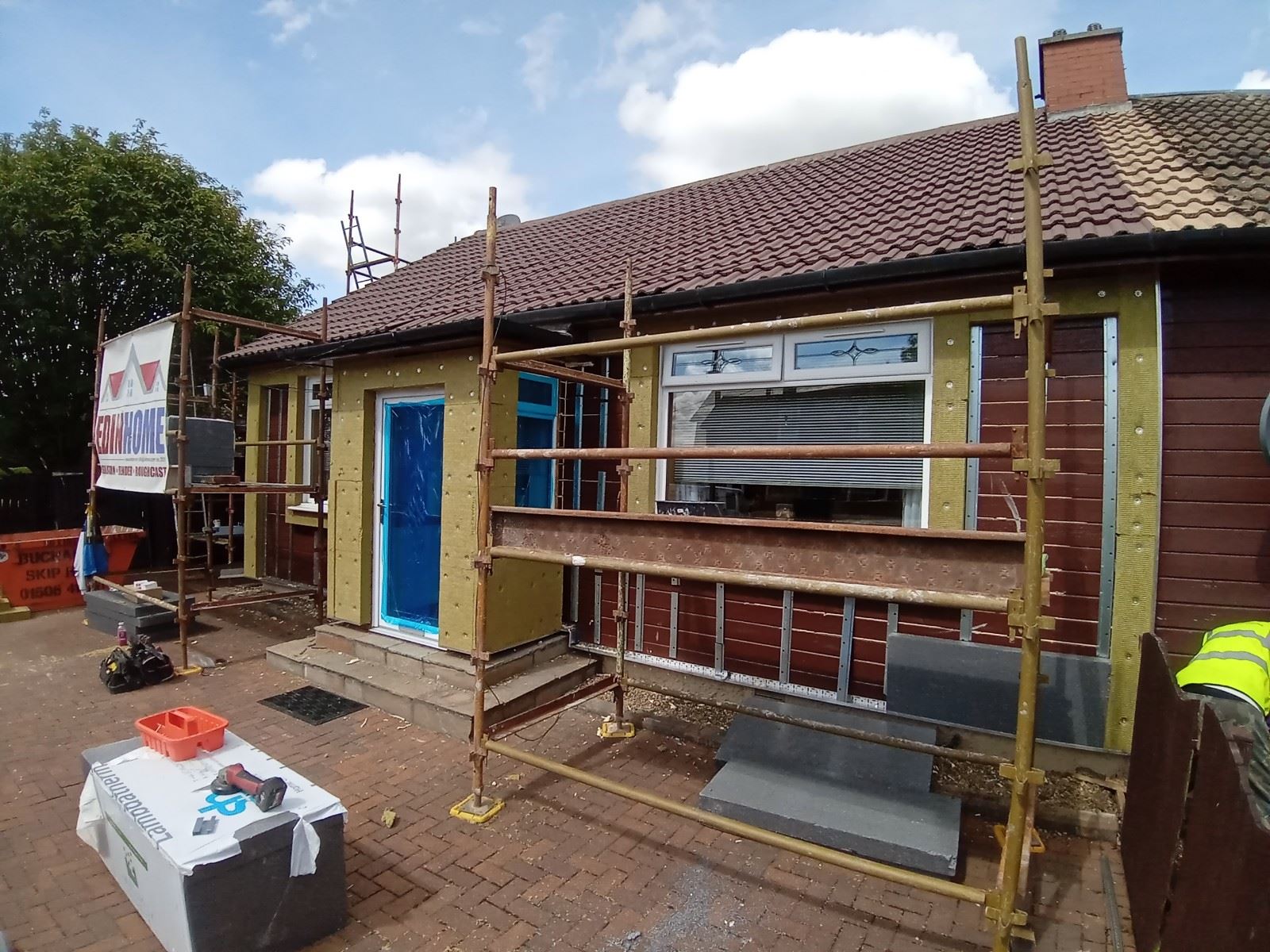 roughcast repair in progress on rear wall with new panels