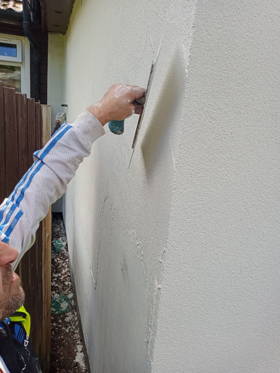 Insulation Edinburgh applied beneath render coat on wall section