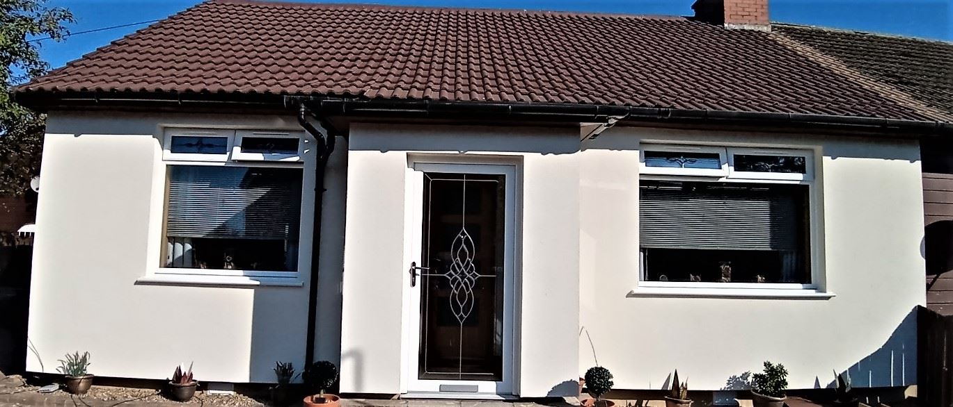 roughcast render Edinburgh on front wall with large window