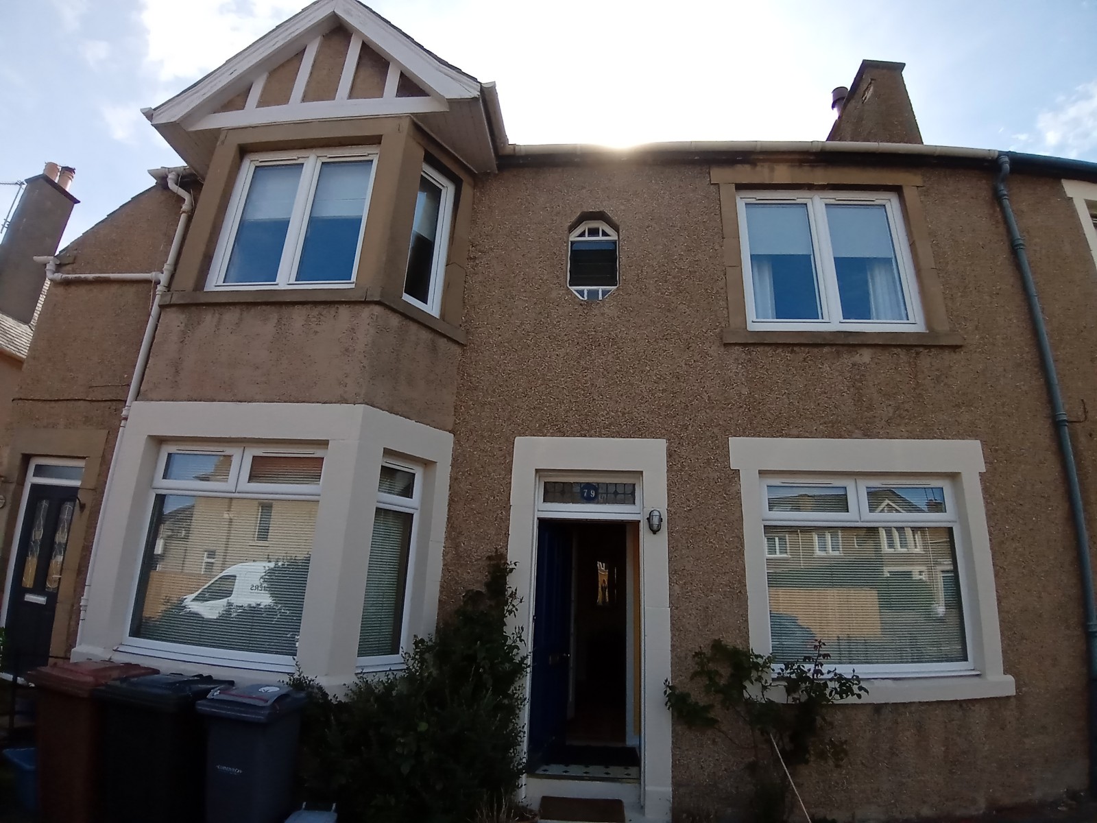 house rendering Edinburgh on traditional brown façade with white trim