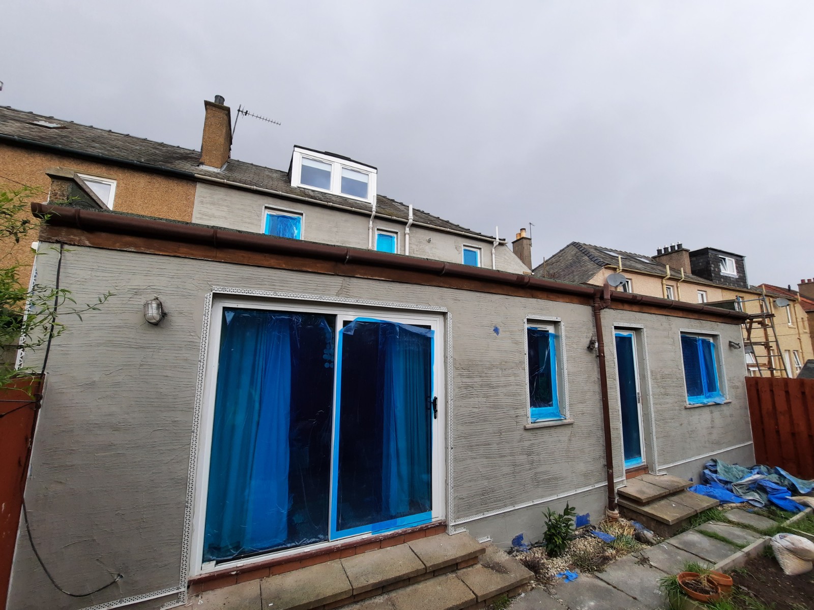 Rendering Edinburgh on rear house wall under grey sky