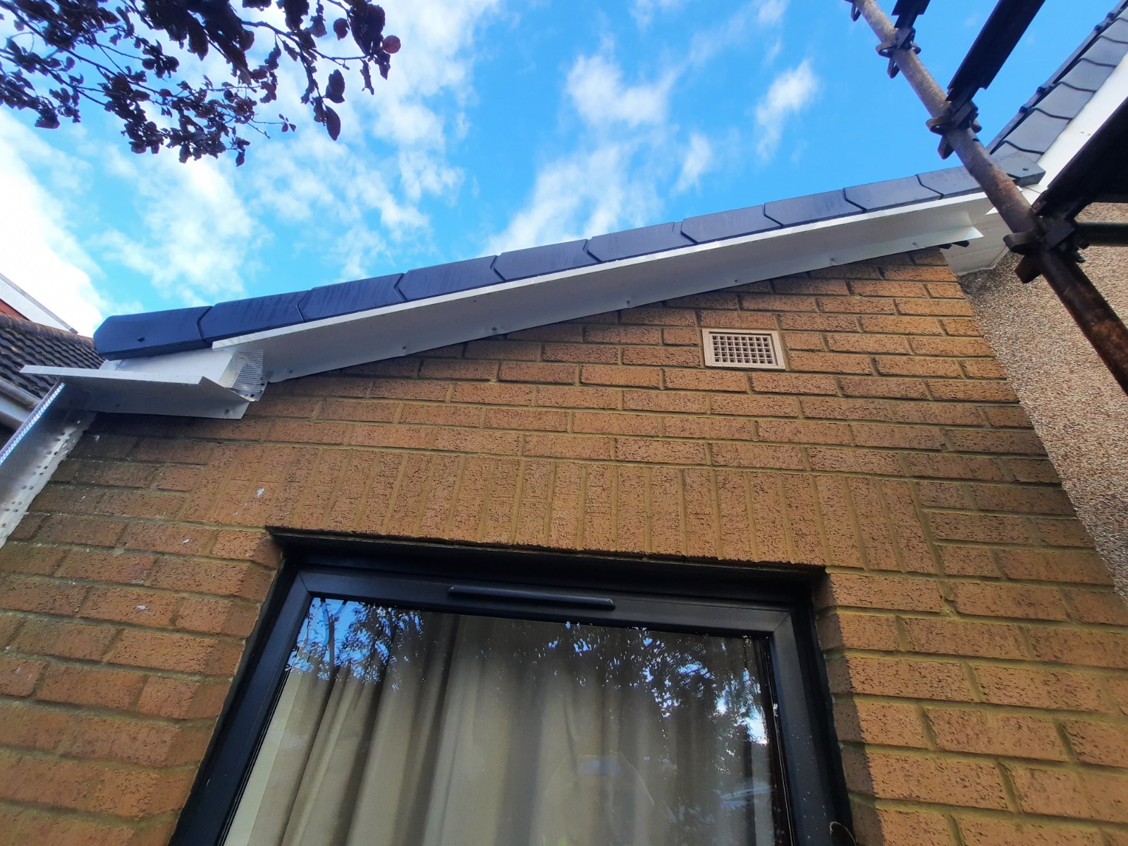 roughcaster Edinburgh finishing detail under roofline and window