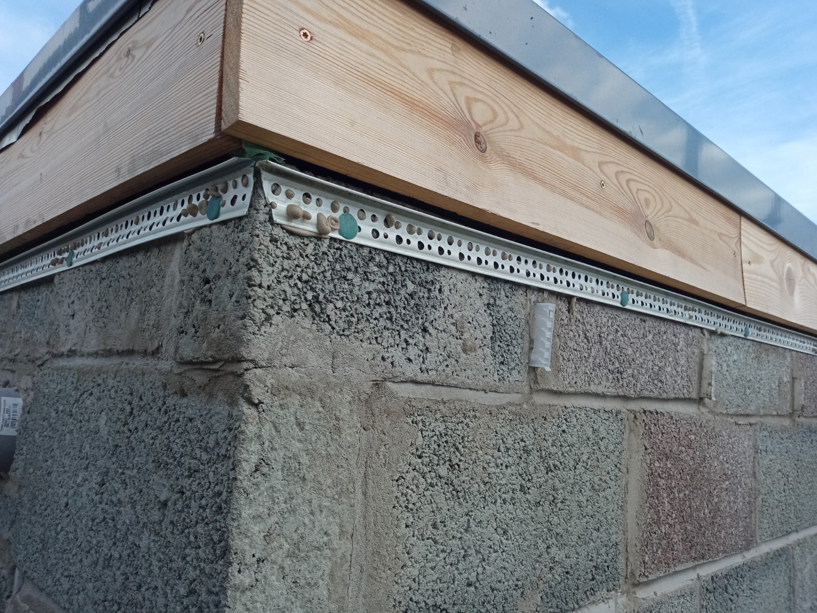 Rendering Edinburgh on blockwork wall before final coat