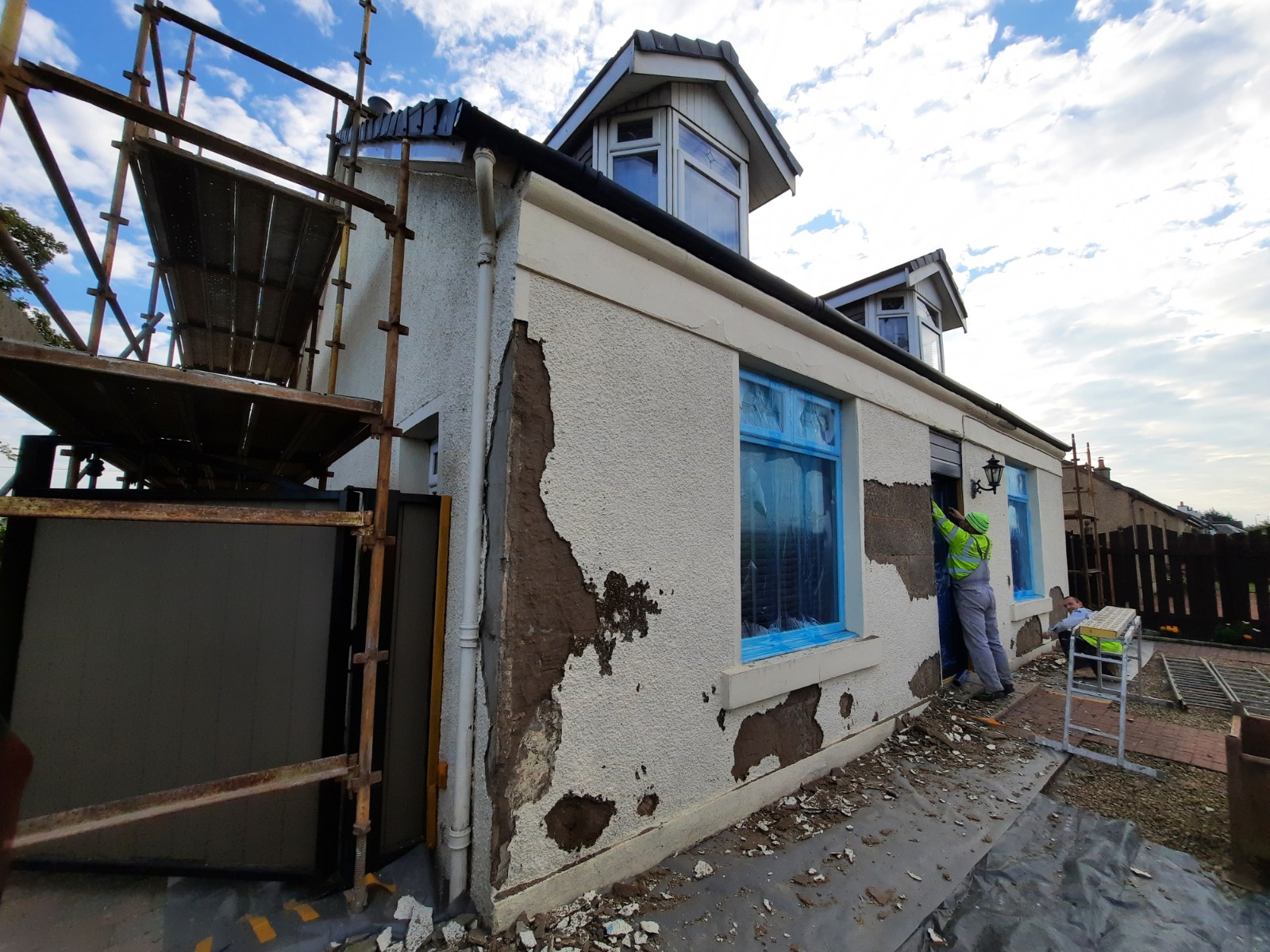 roughcast repair patching exposed brick and render sections