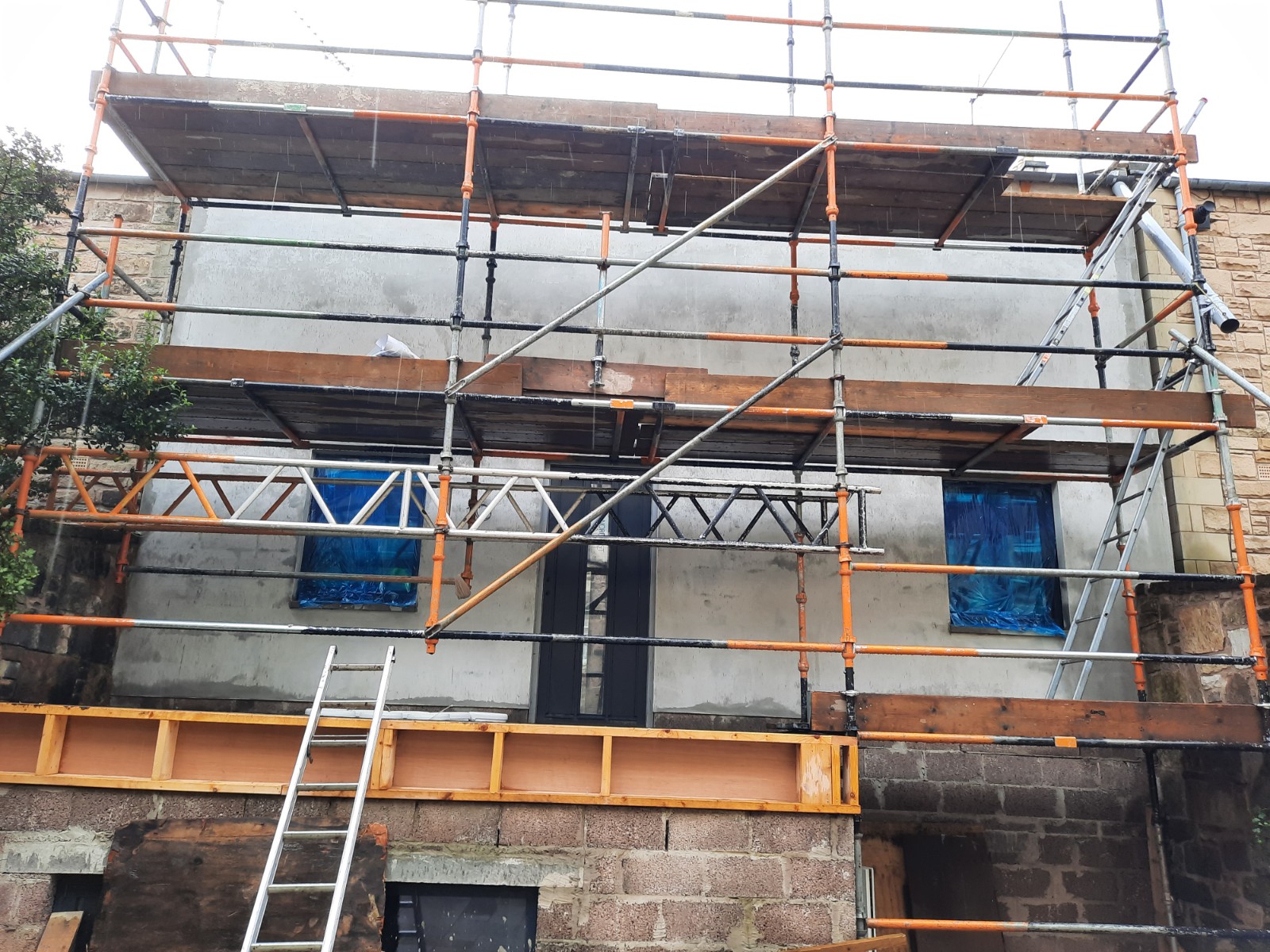 Rendering Edinburgh on front elevation under scaffolding
