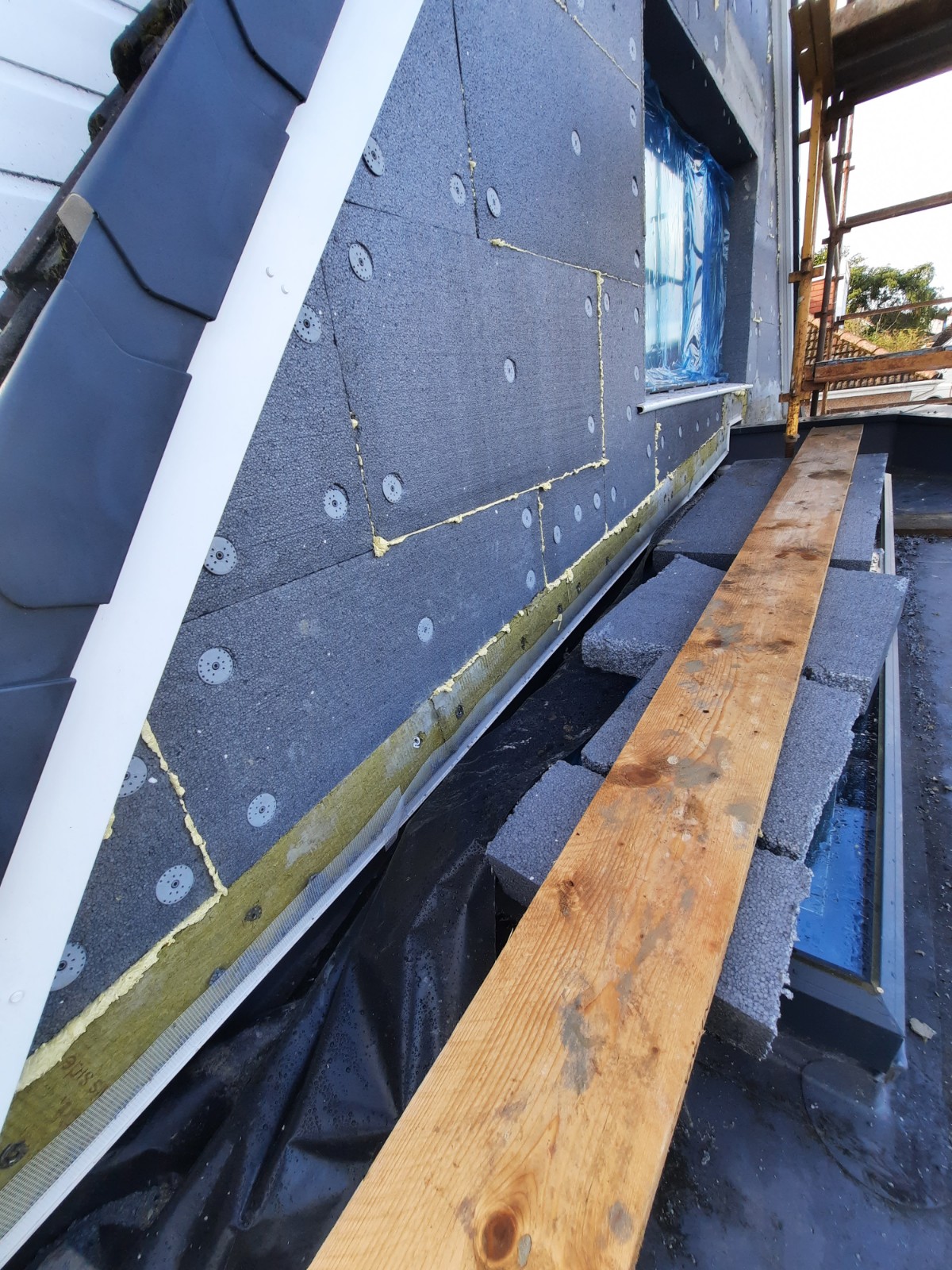 external wall insulation Edinburgh with fixings below window sill