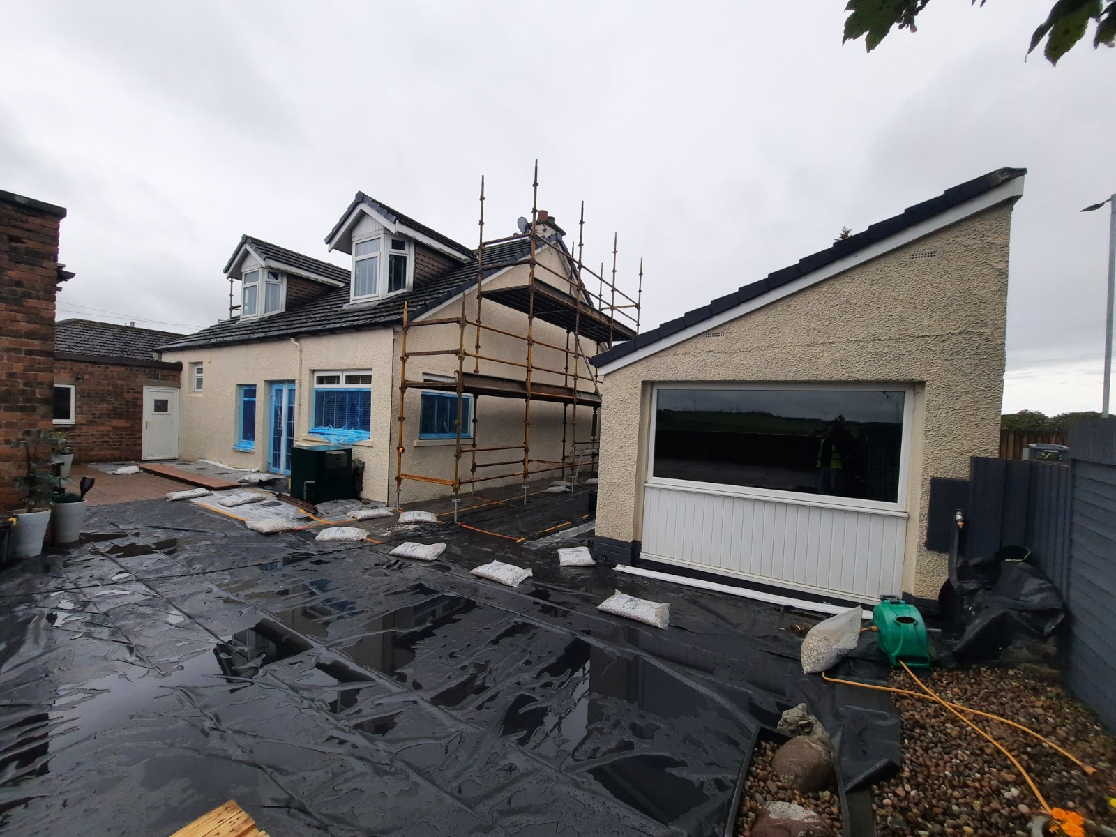 roughcasting Edinburgh on side elevation of bungalow during renovation
