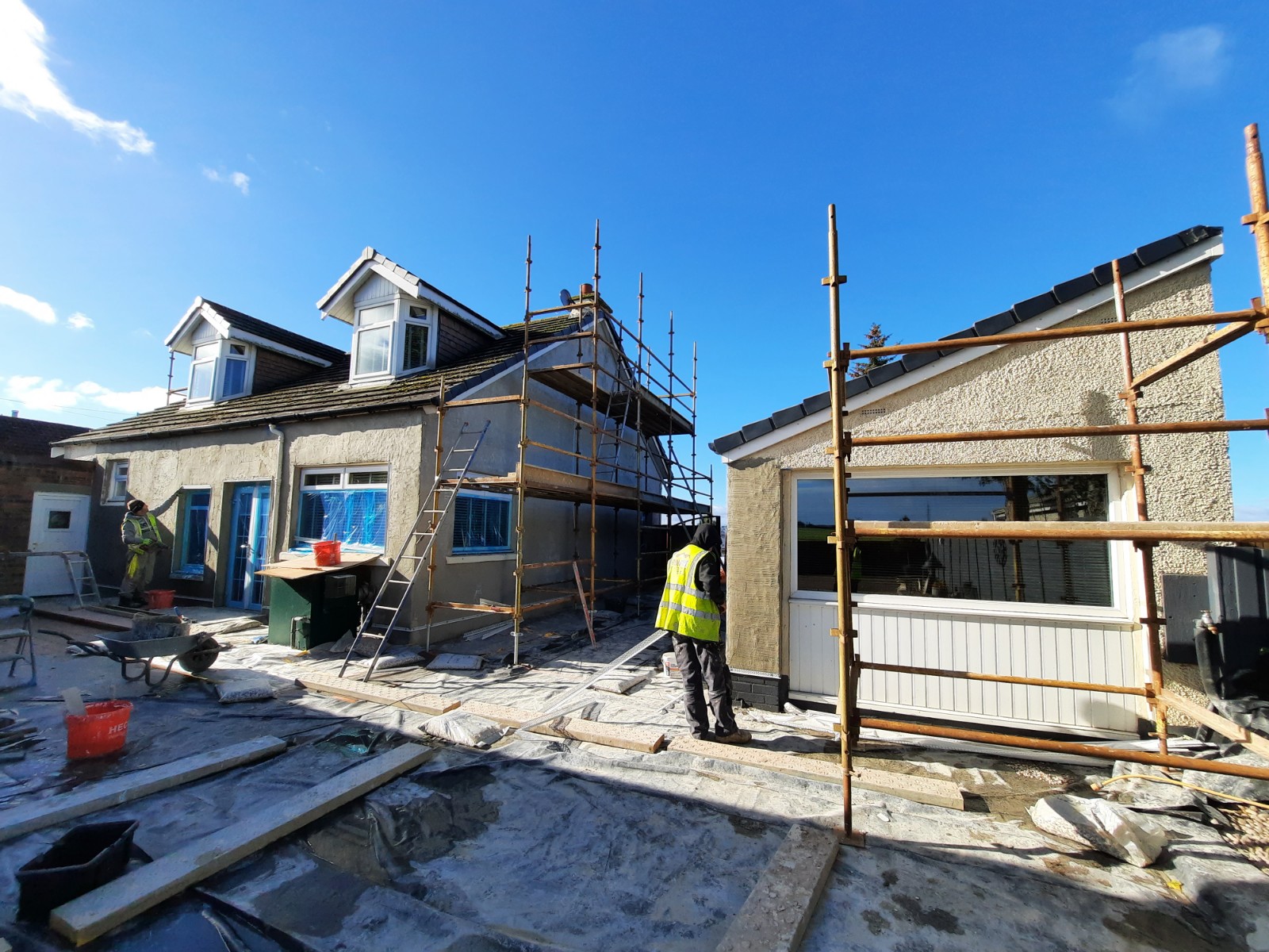sunny day progress on external wall insulation Edinburgh