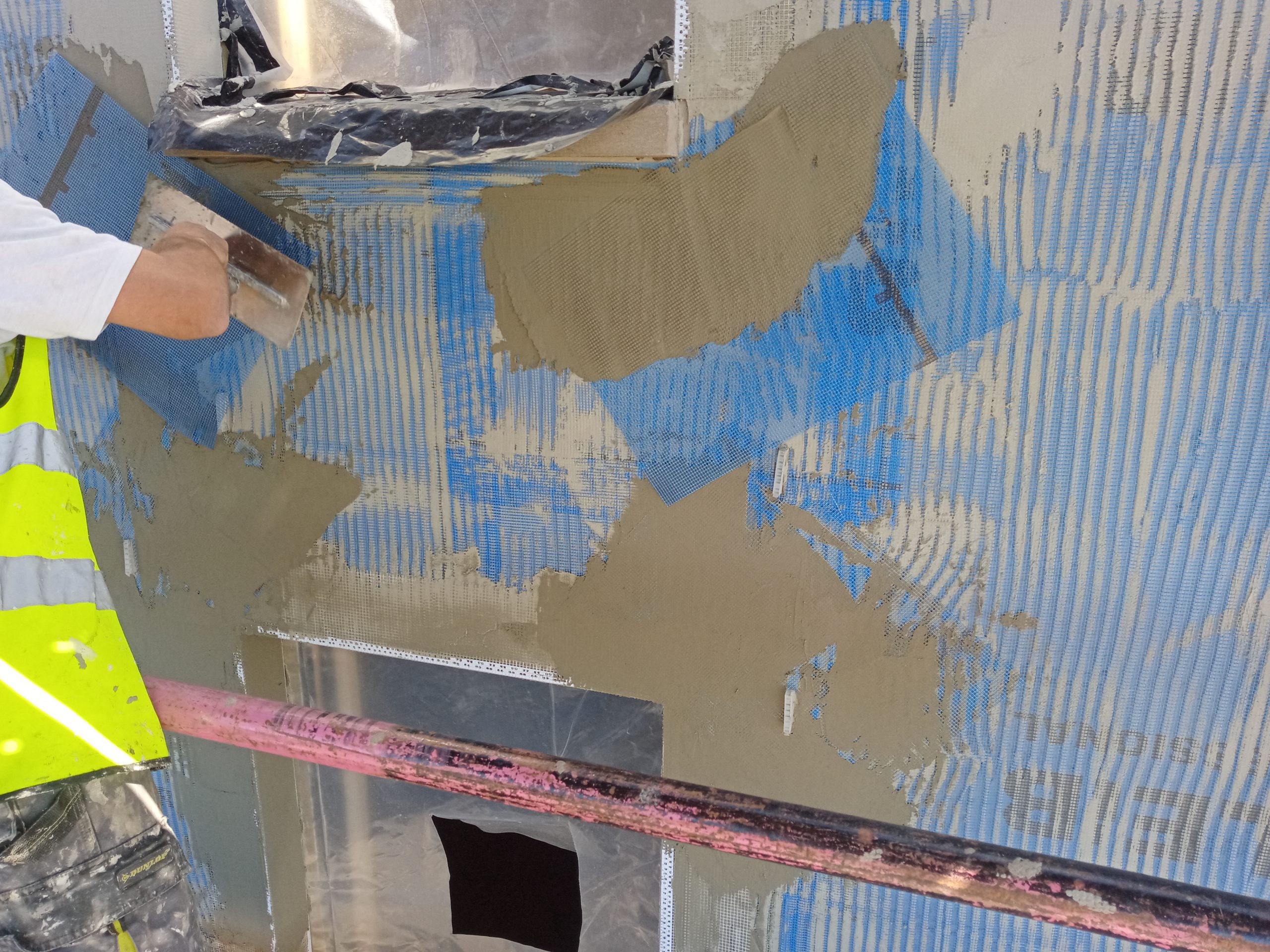 roughcast render Edinburgh applied over blue mesh layer