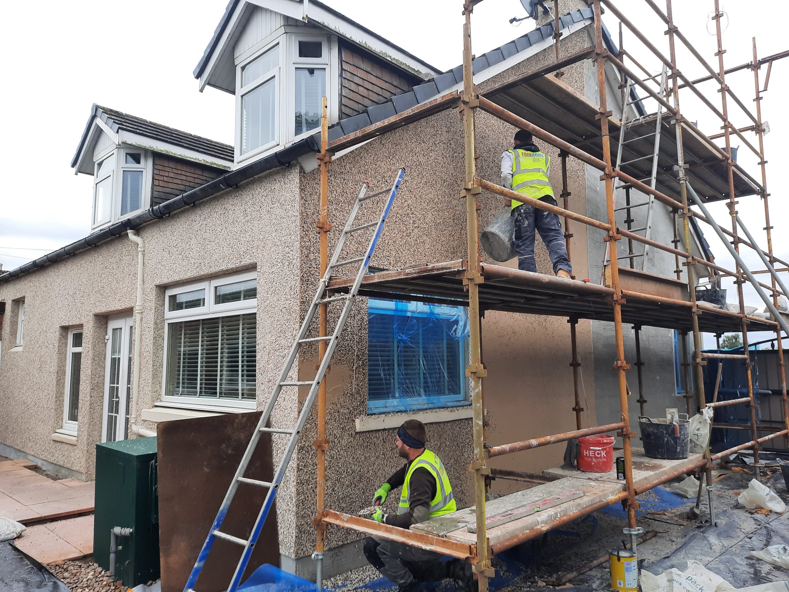 workers applying external wall insulation Edinburgh