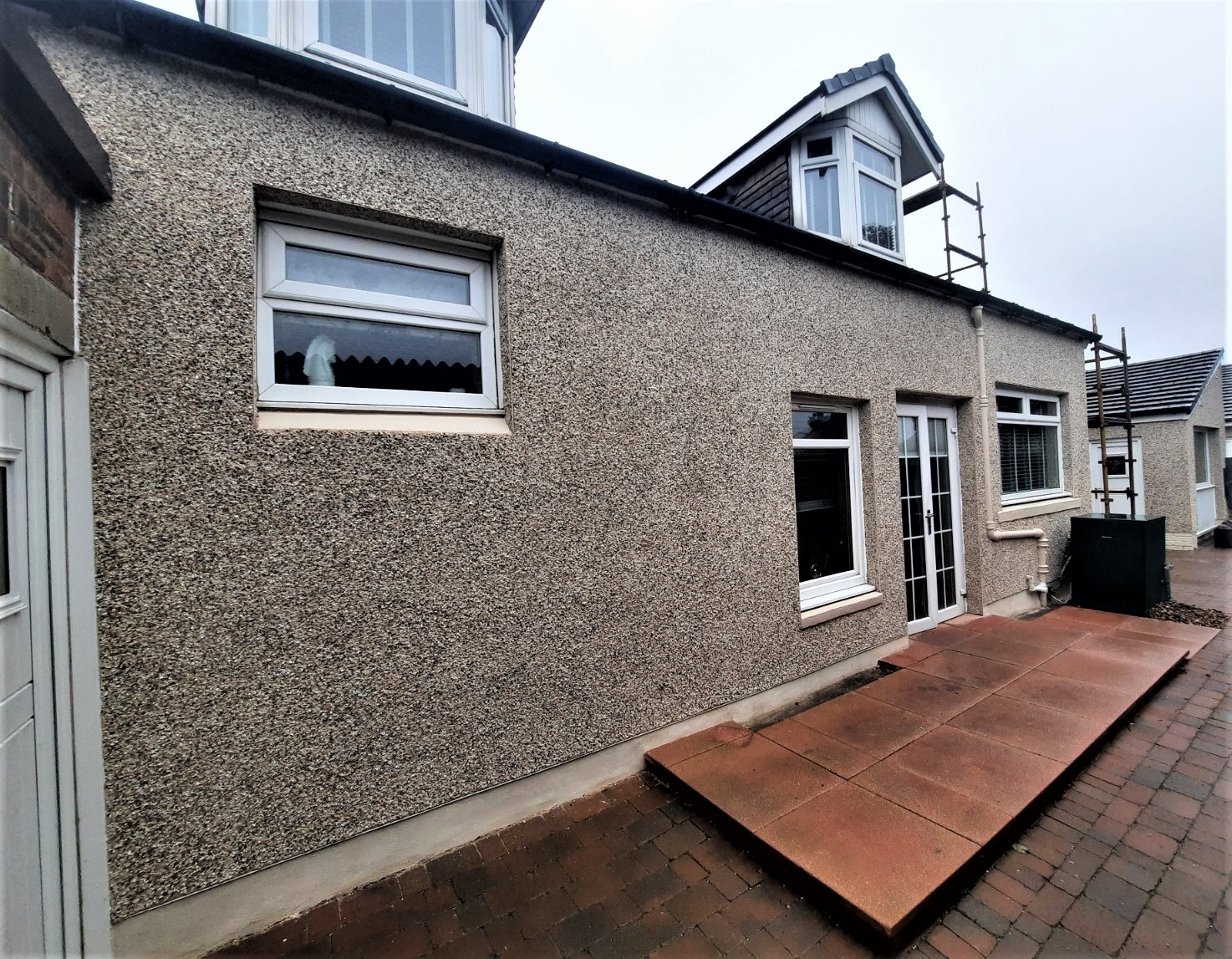 long side wall finished with roughcast render Edinburgh
