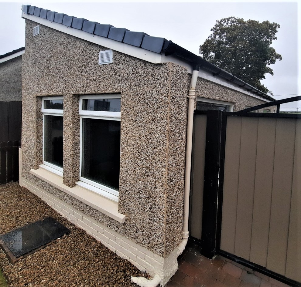 front view showing roughcast render Edinburgh on bungalow
