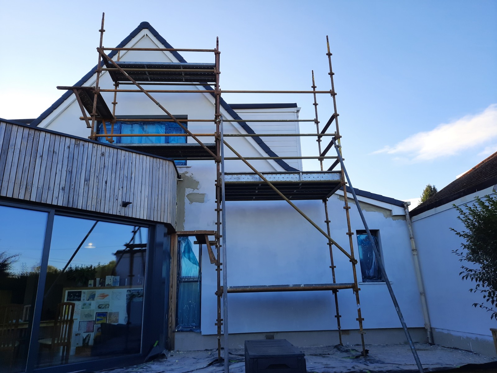 solid wall insulation Edinburgh applied to modern house under scaffold