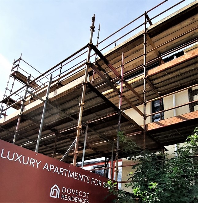 roughcaster Edinburgh working on renovation from scaffold base