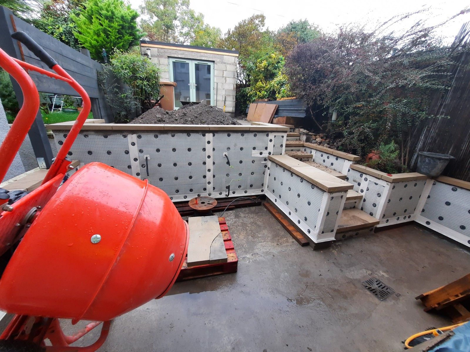 garden area under preparation for roughcast render repair