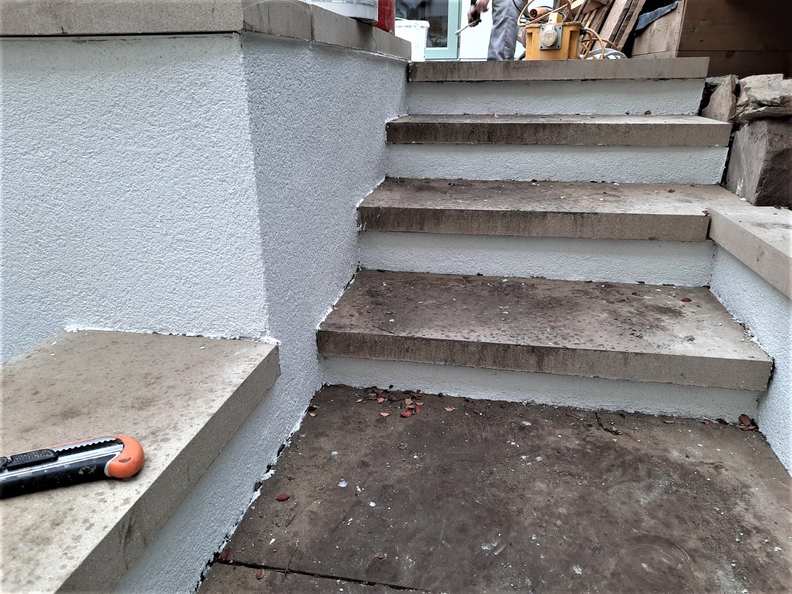 close-up of stair wall finished by roughcaster Edinburgh
