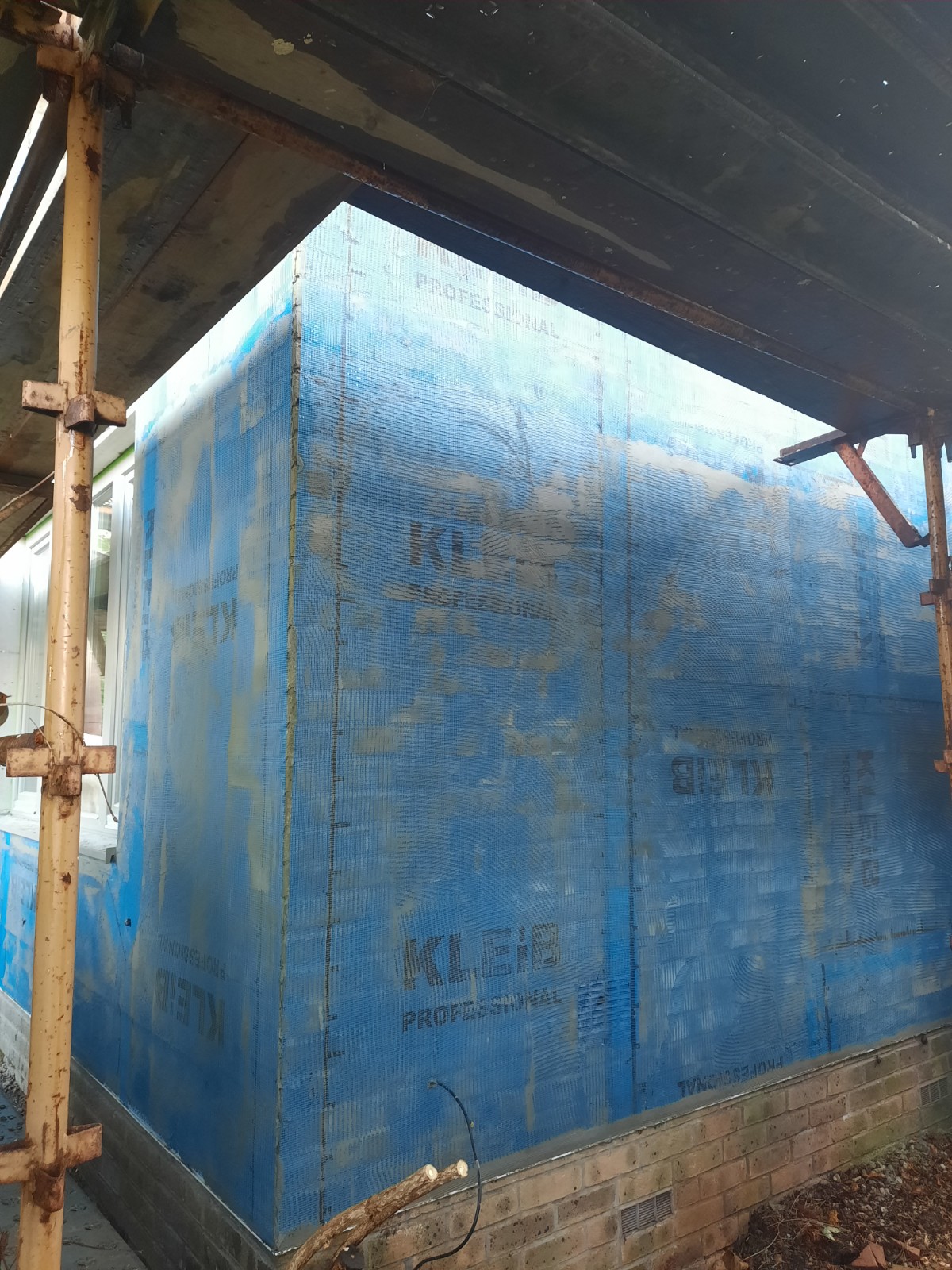 blue mesh wrap for roughcasting Edinburgh project
