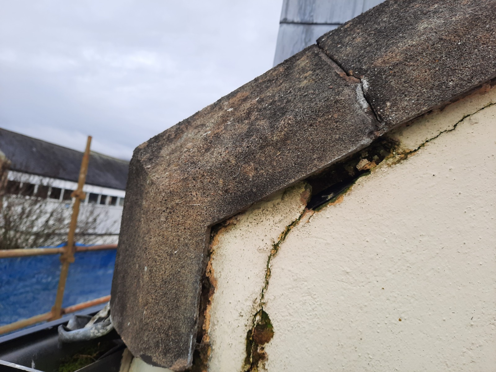 weathered corner showing need for roughcast render repair