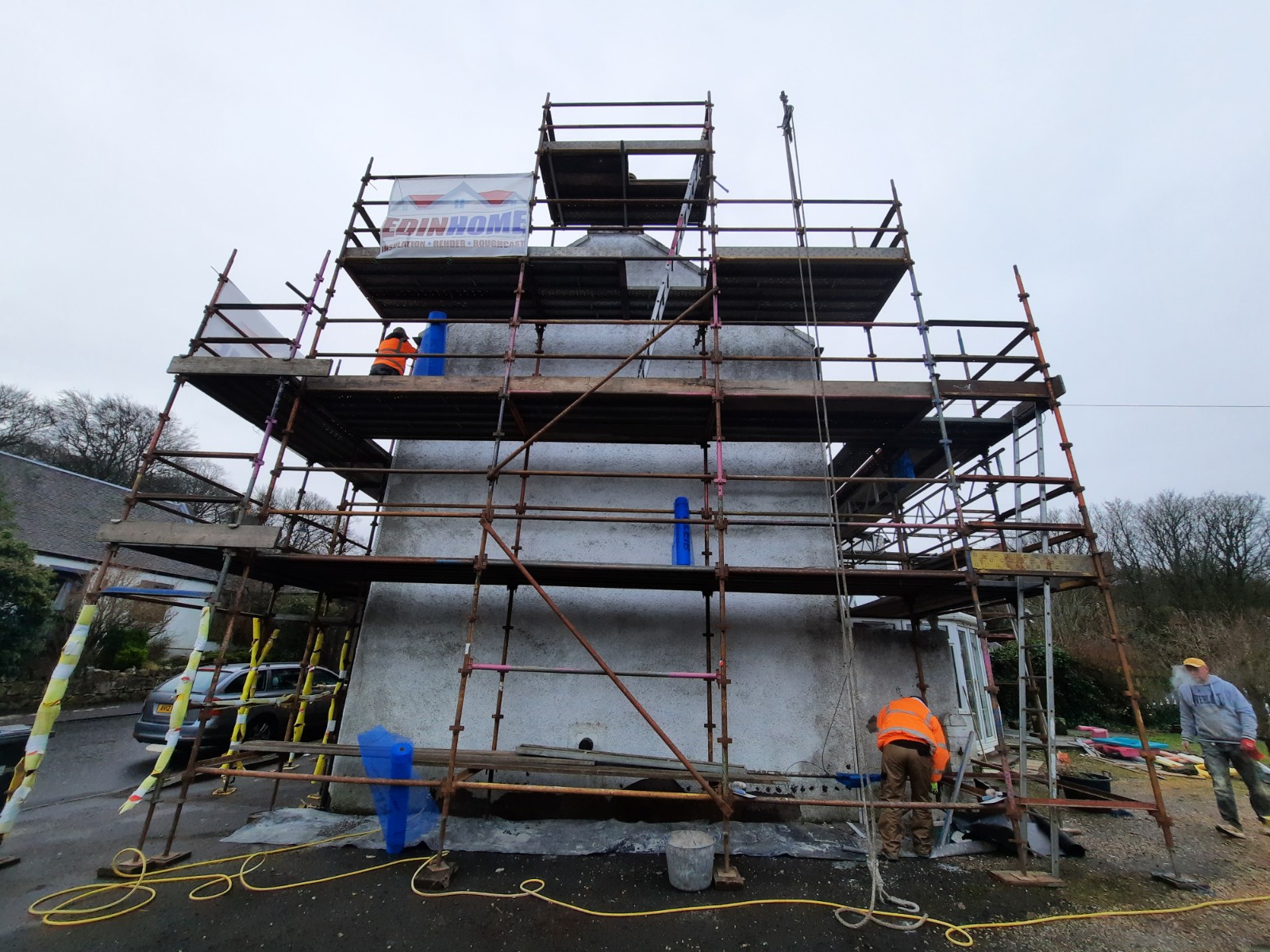 scaffolding set up for roughcast repair on house front