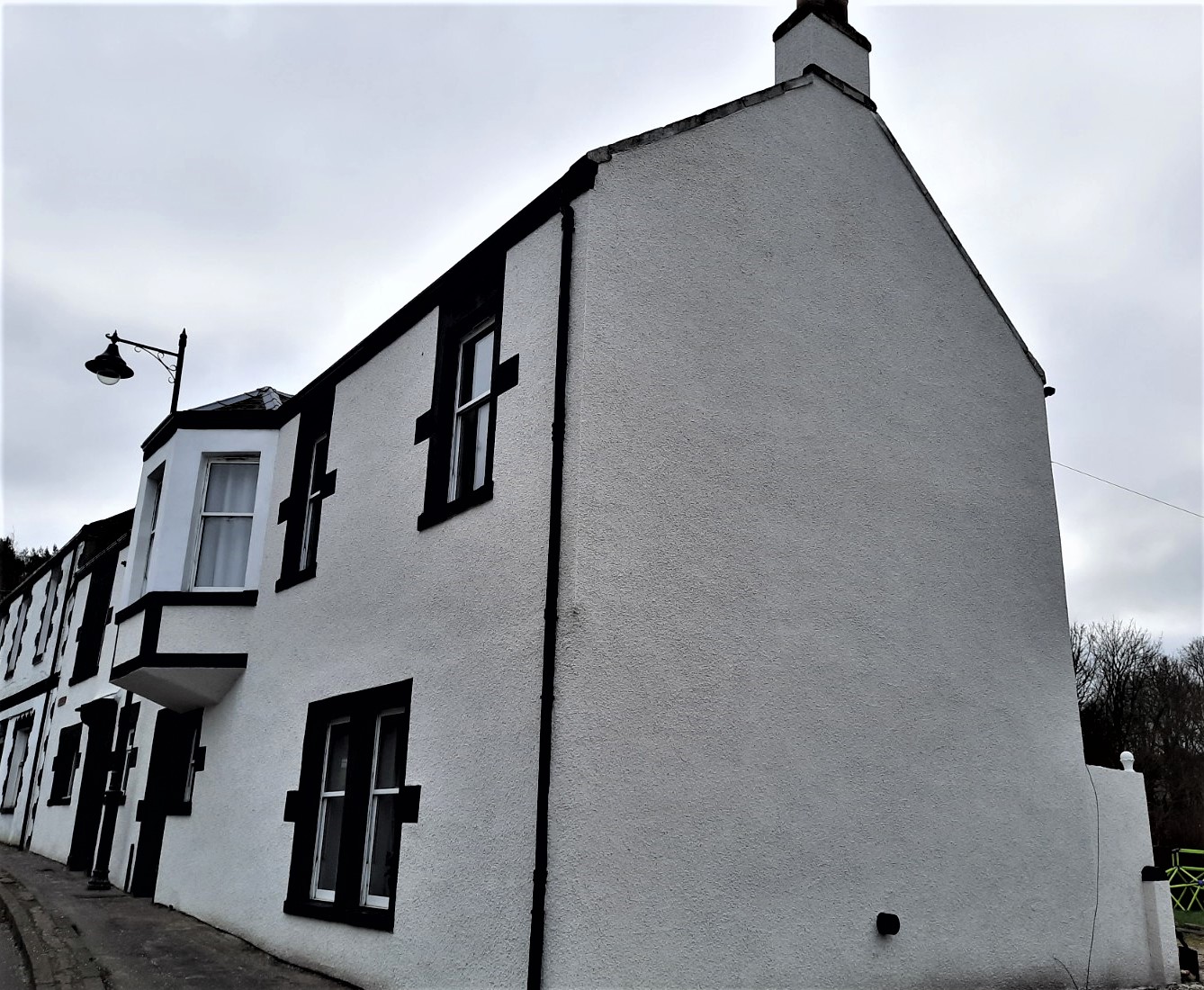 gable end showing neat roughcast repair