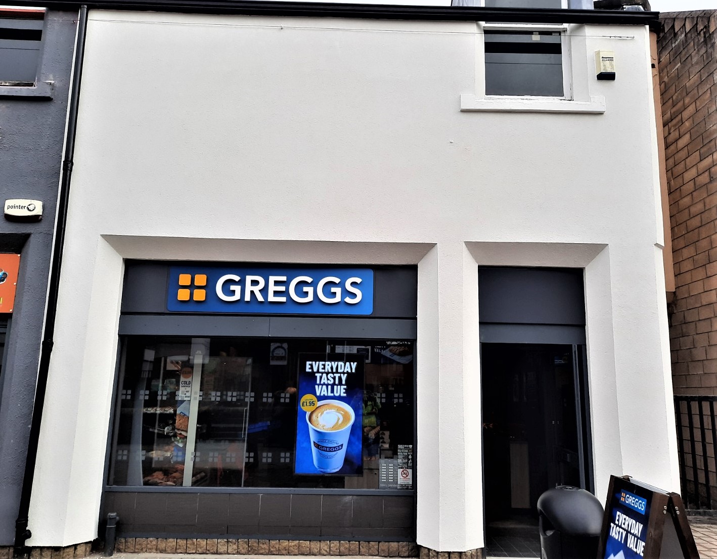 white shop facade with roughcast render Edinburgh