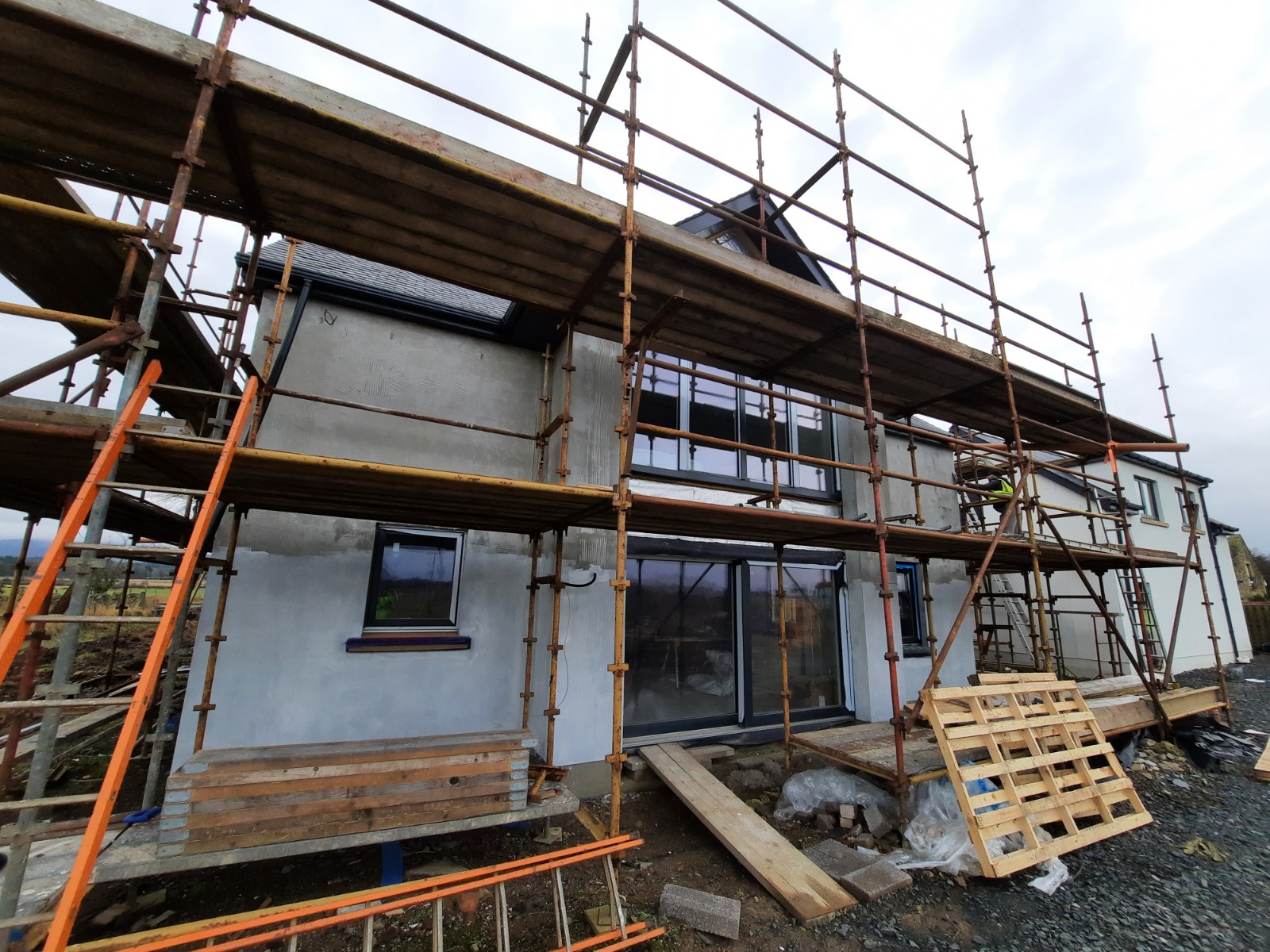 grey facade mid roughcast render repair