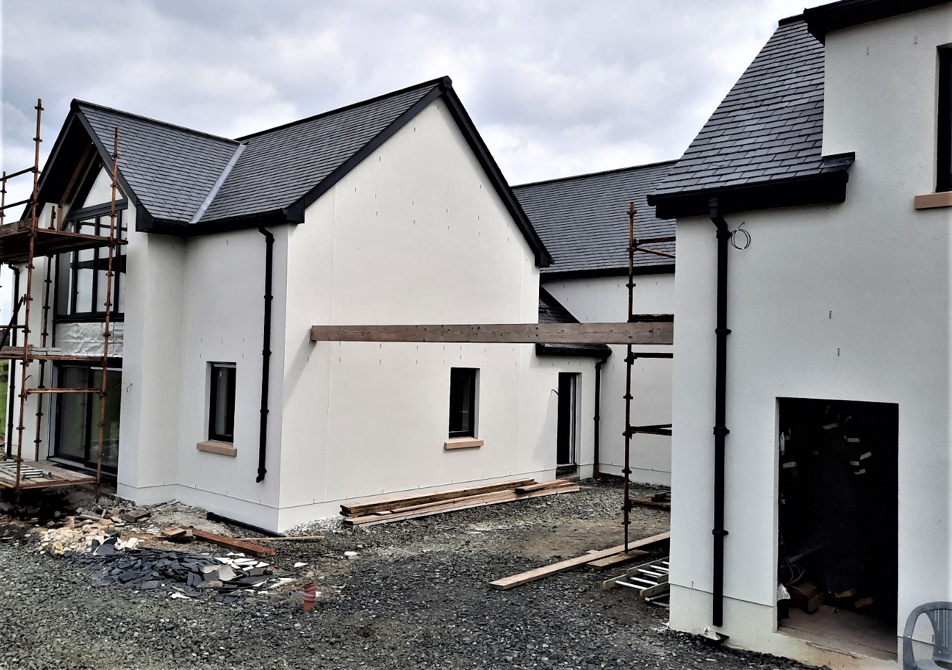 L-shaped home after roughcast repair