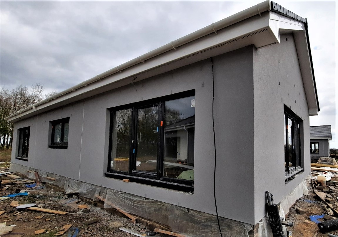 long wall with large windows and external wall insulation Edinburgh
