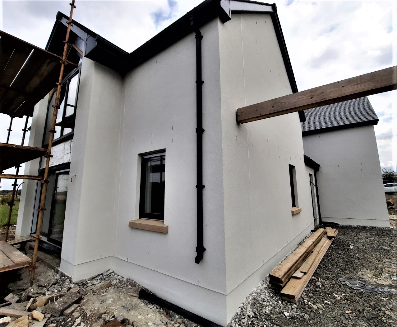 rear angle showing fresh roughcast render repair