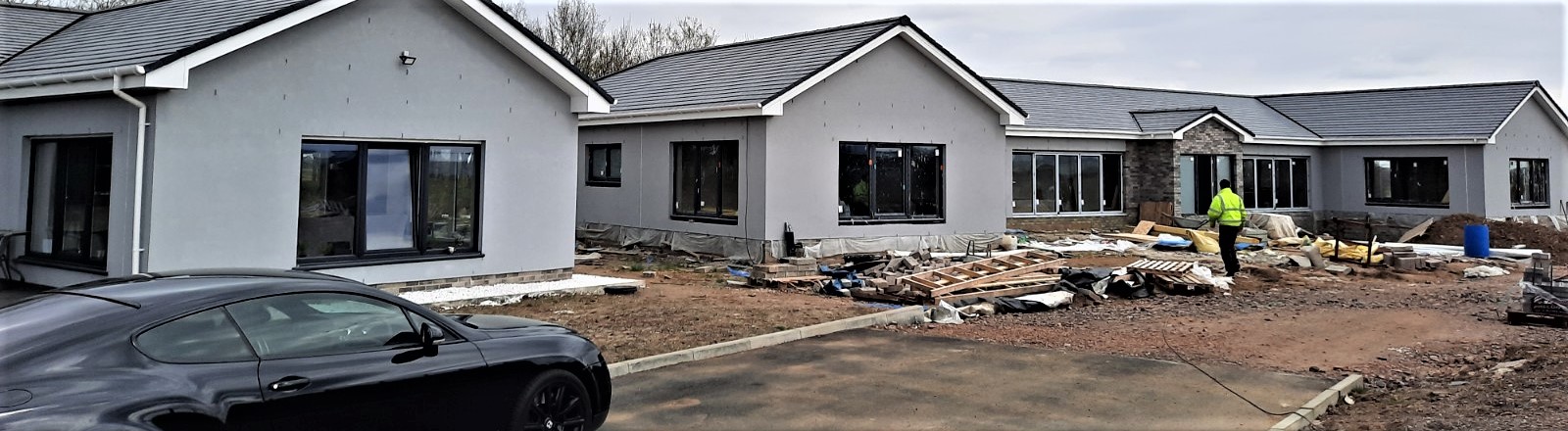 front and side view of roughcast render Edinburgh finish