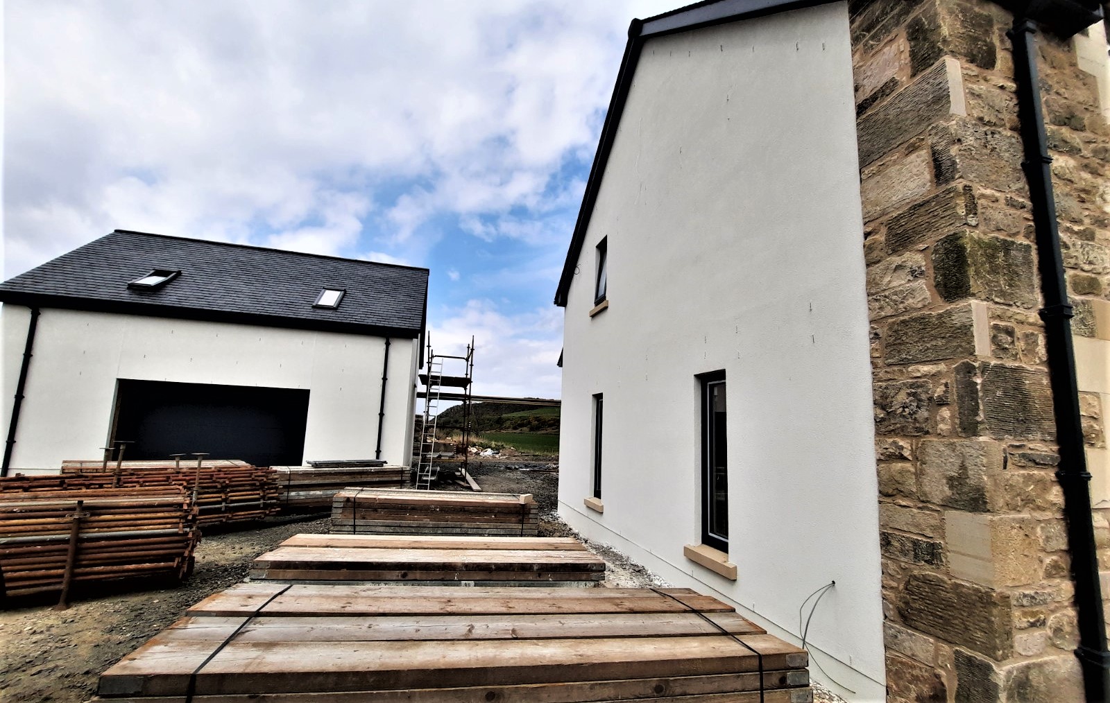 bright white gable finished with roughcast render Edinburgh