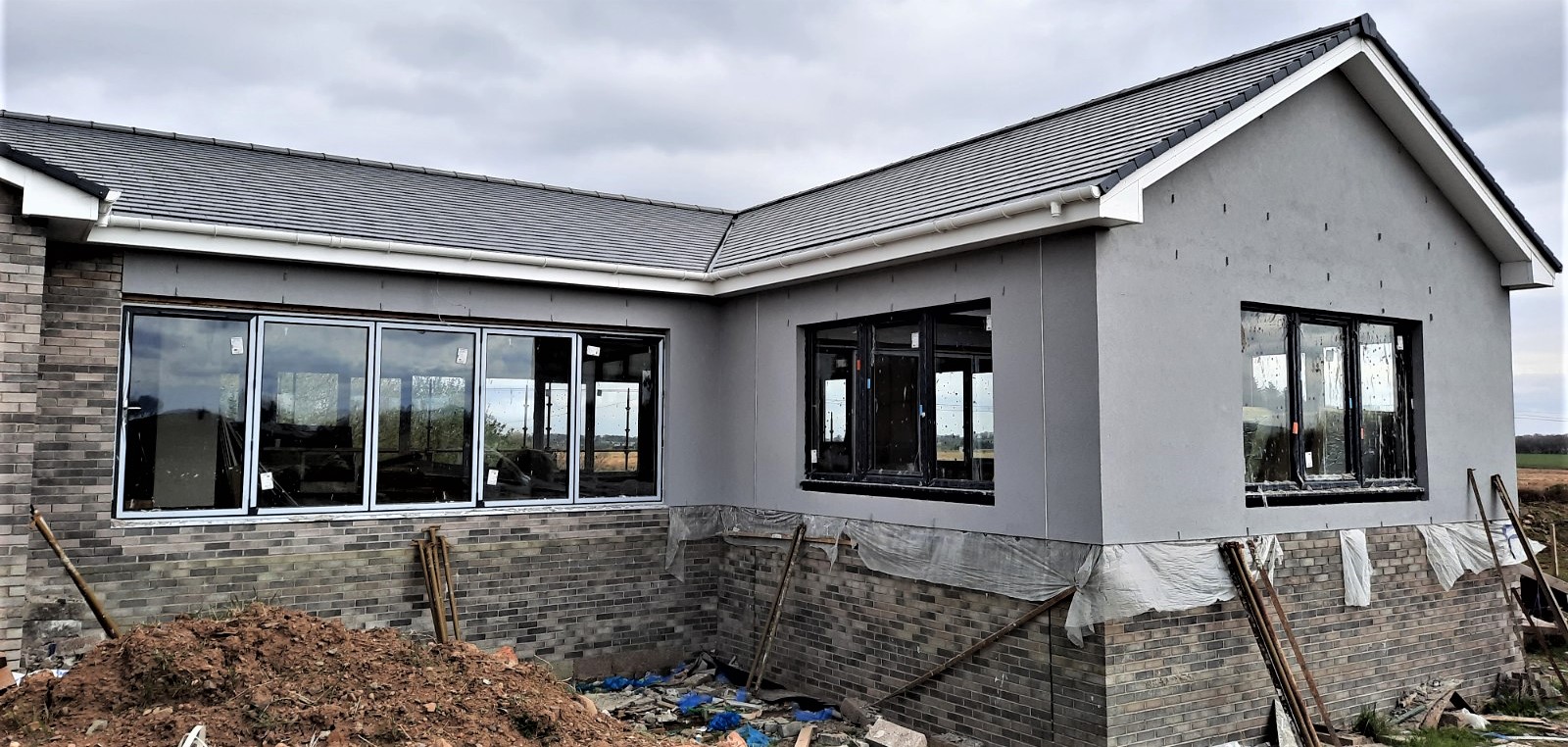 garage side of home with roughcast render Edinburgh