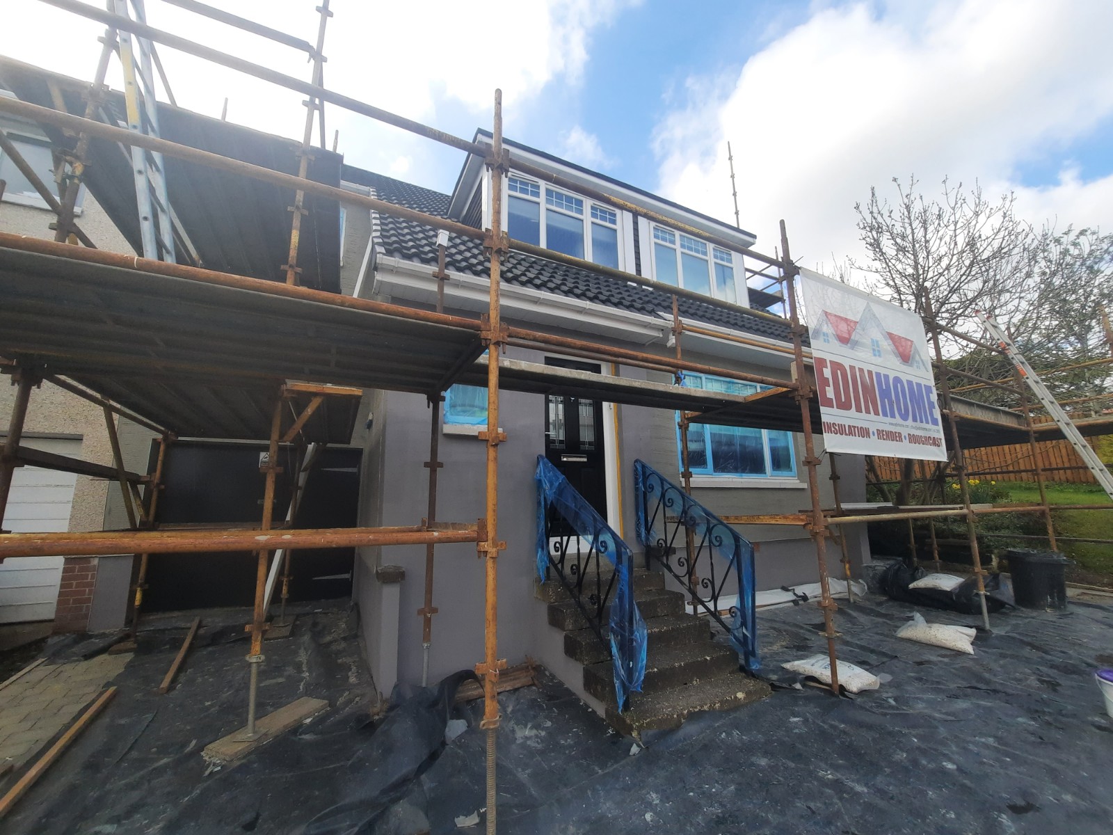 progress on roughcast render repair under scaffolding