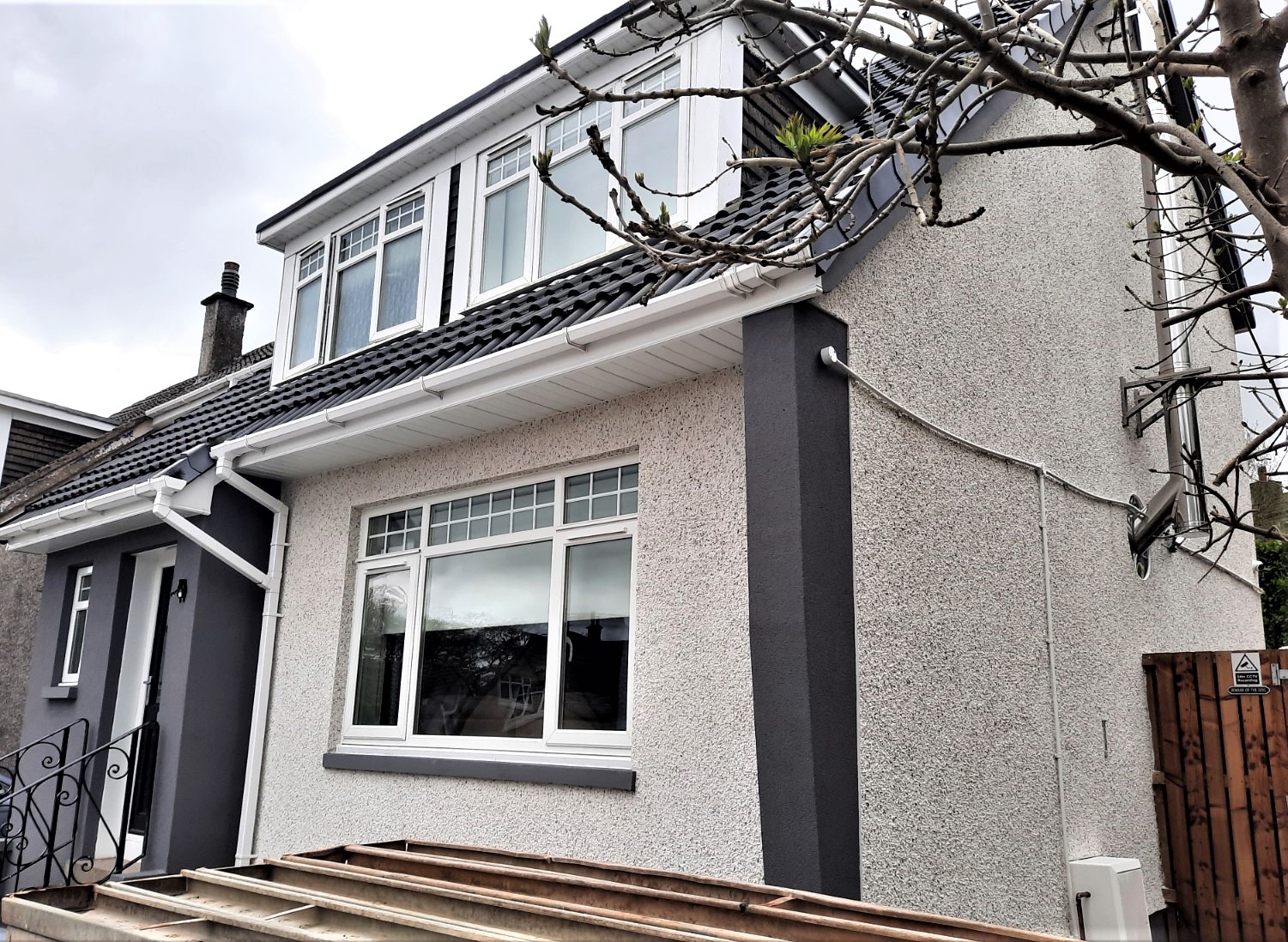 house front showing new roughcast repair