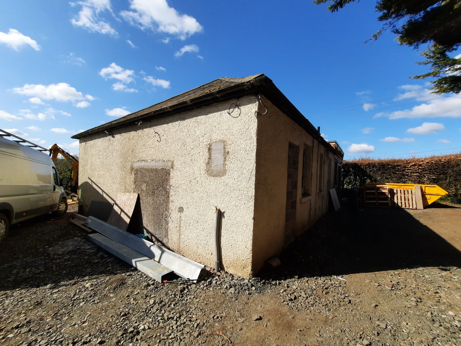 house rendering Edinburgh on side wall with light pebble dash finish