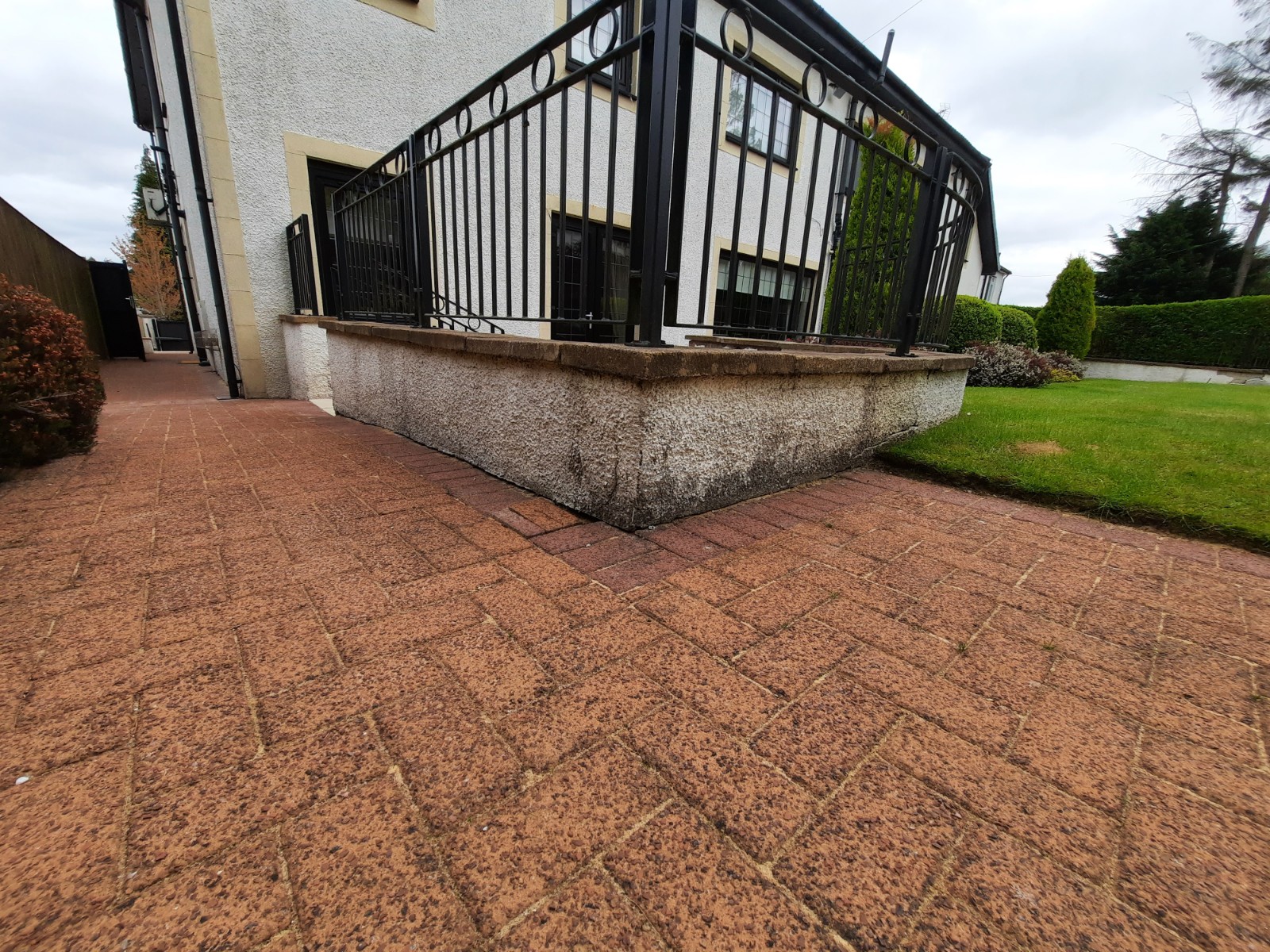 roughcast repair on low wall under conservatory extension