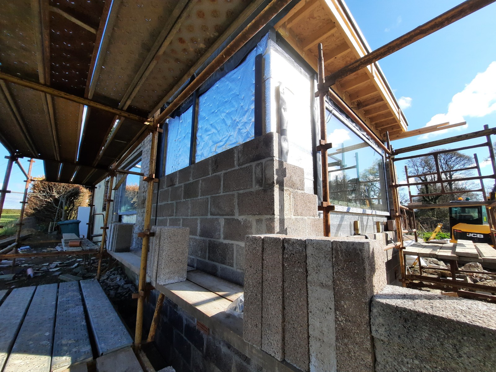 roughcast render repair on interior block wall before coating