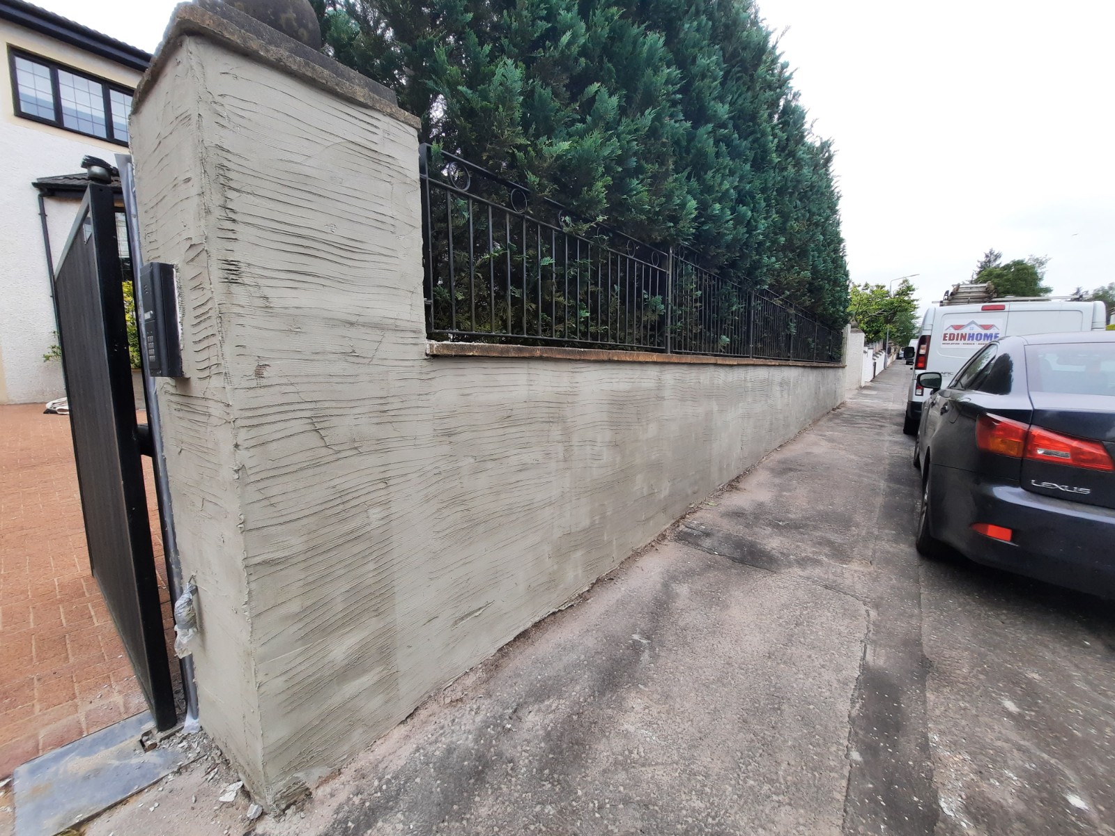 external wall insulation Edinburgh applied to tall roadside wall