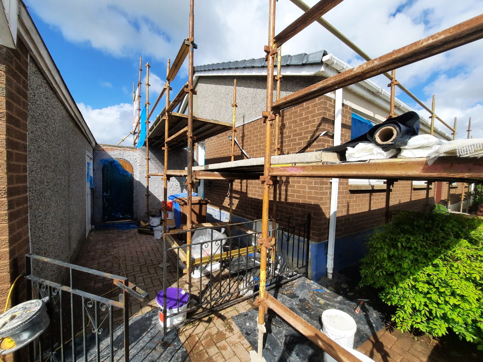 Rendering Edinburgh on rear conservatory wall with scaffolding