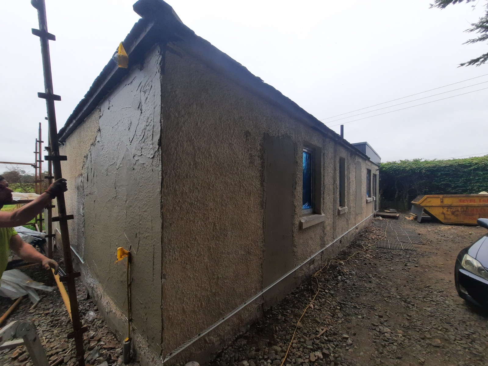 roughcast render repair on gable end wall with fresh coat