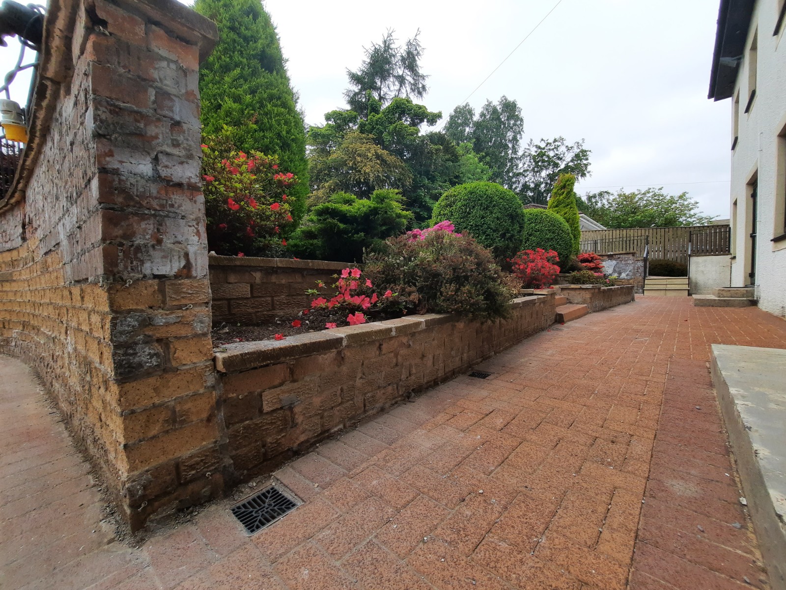 roughcast render repair around garden entrance gate