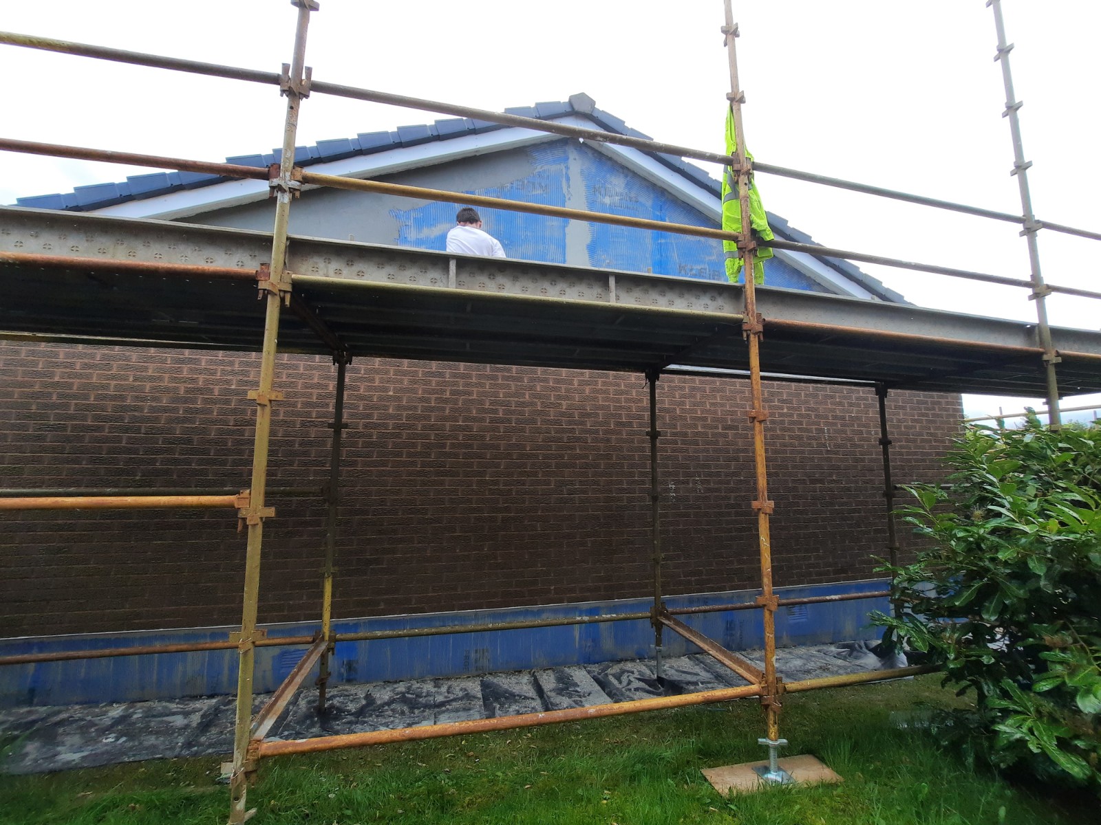 roughcaster Edinburgh working on rear elevation with brick and render
