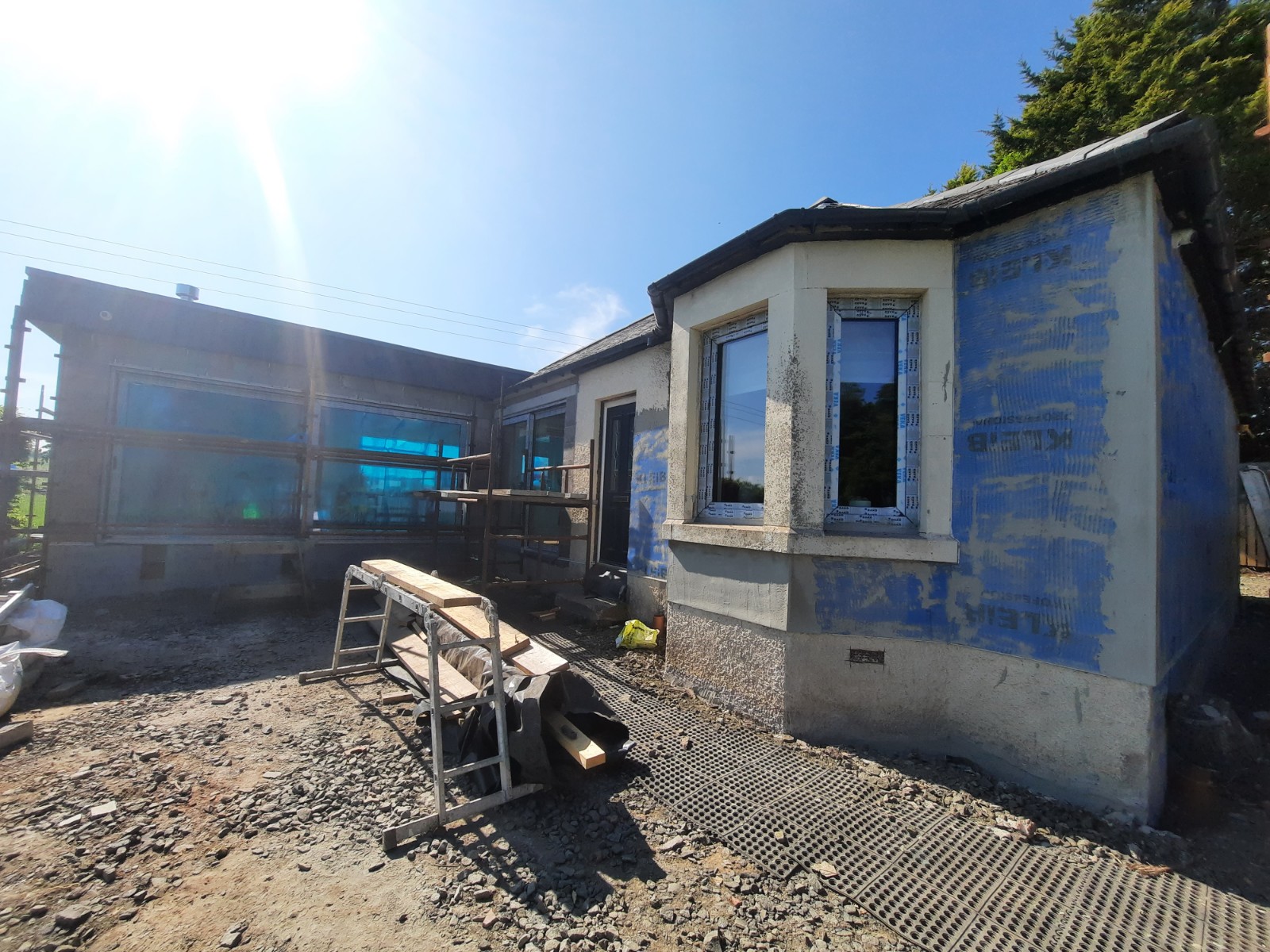 Insulation Edinburgh behind blue protective wall covering